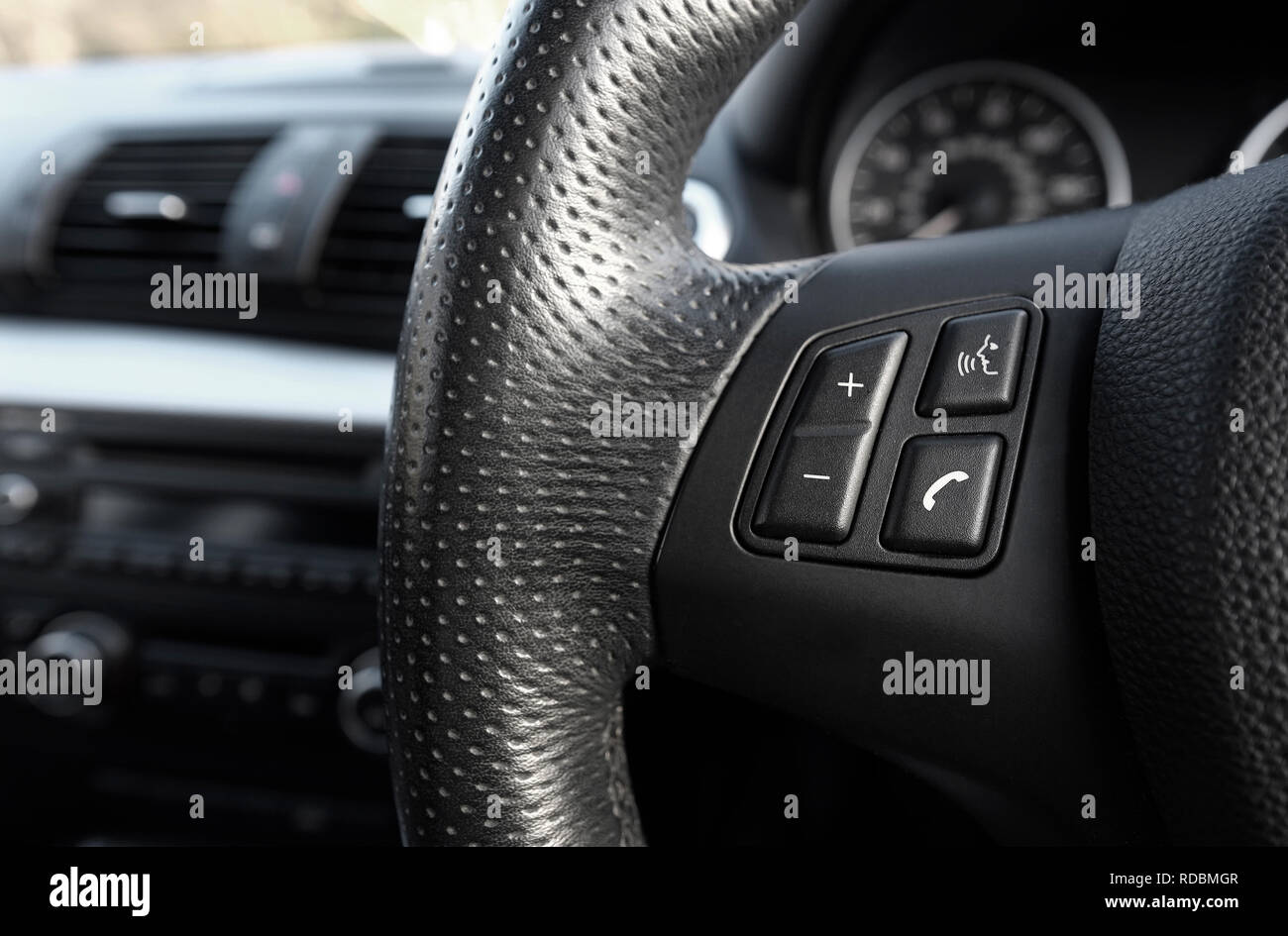 mobile phone buttons on car steering wheel Stock Photo