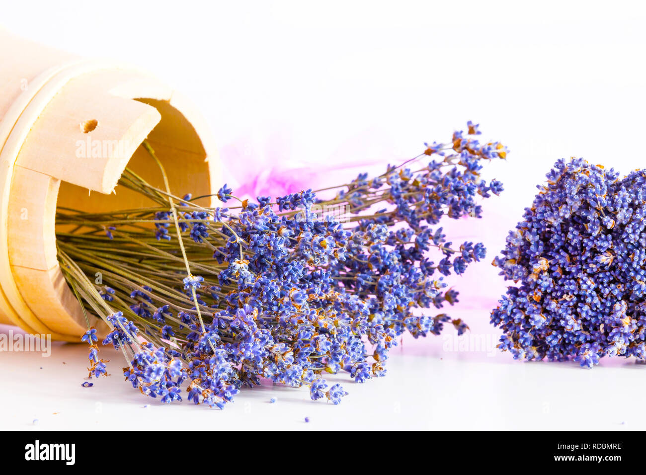 Bunch of dry wild mountain lavender flowers and wooden bowl Stock Photo