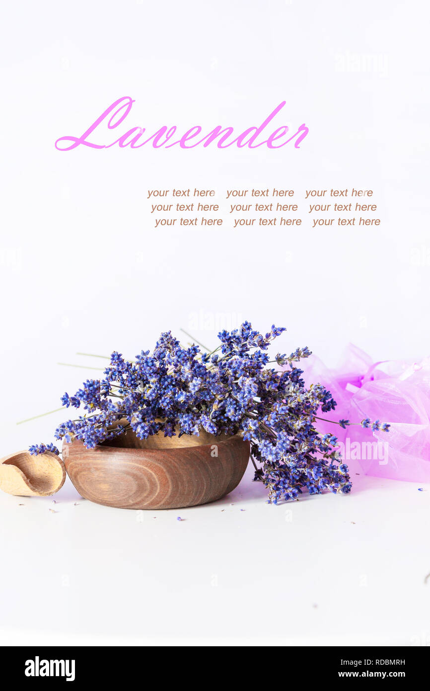 Making aroma bags, bunch of dry wild mountain lavender flowers and wooden bowl Stock Photo