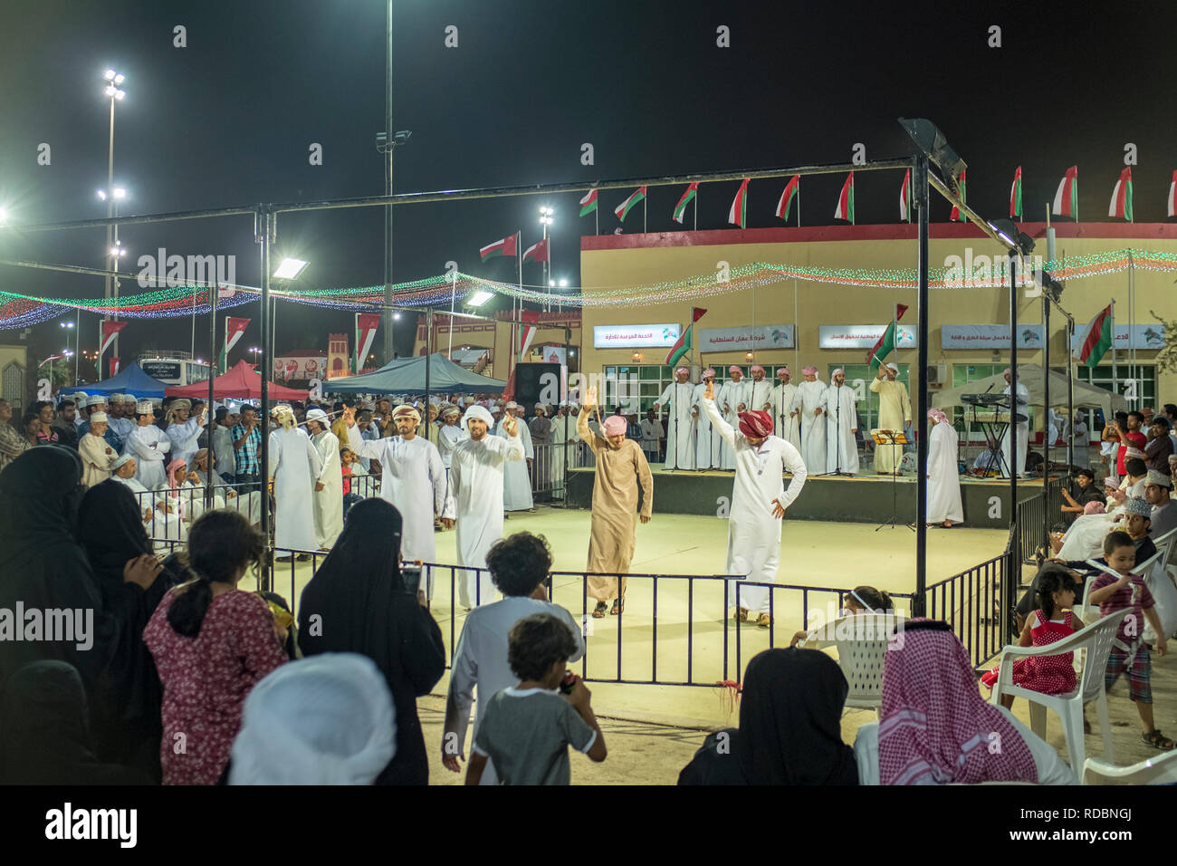 men-wearing-omani-dress-dishdash-and-turban-performing-a