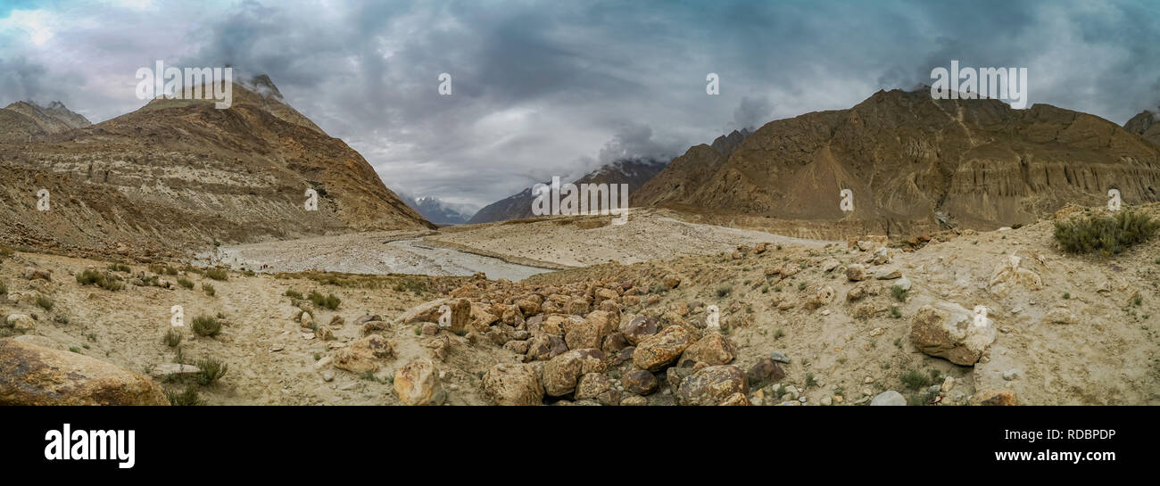 Panoramic view of a beautiful valley in Karakoram Mountain Range in Pakistan, on cloudy day. Stock Photo