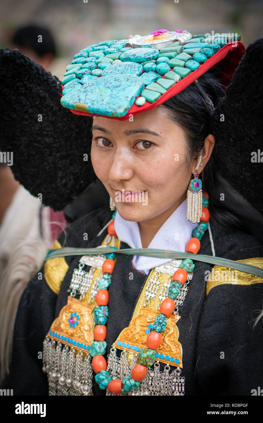 Ladakh, India - September 4, 2018: Portrait of an attractive young ethnic Indian in traditional clothes on festival in Ladakh. Illustrative editorial. Stock Photo