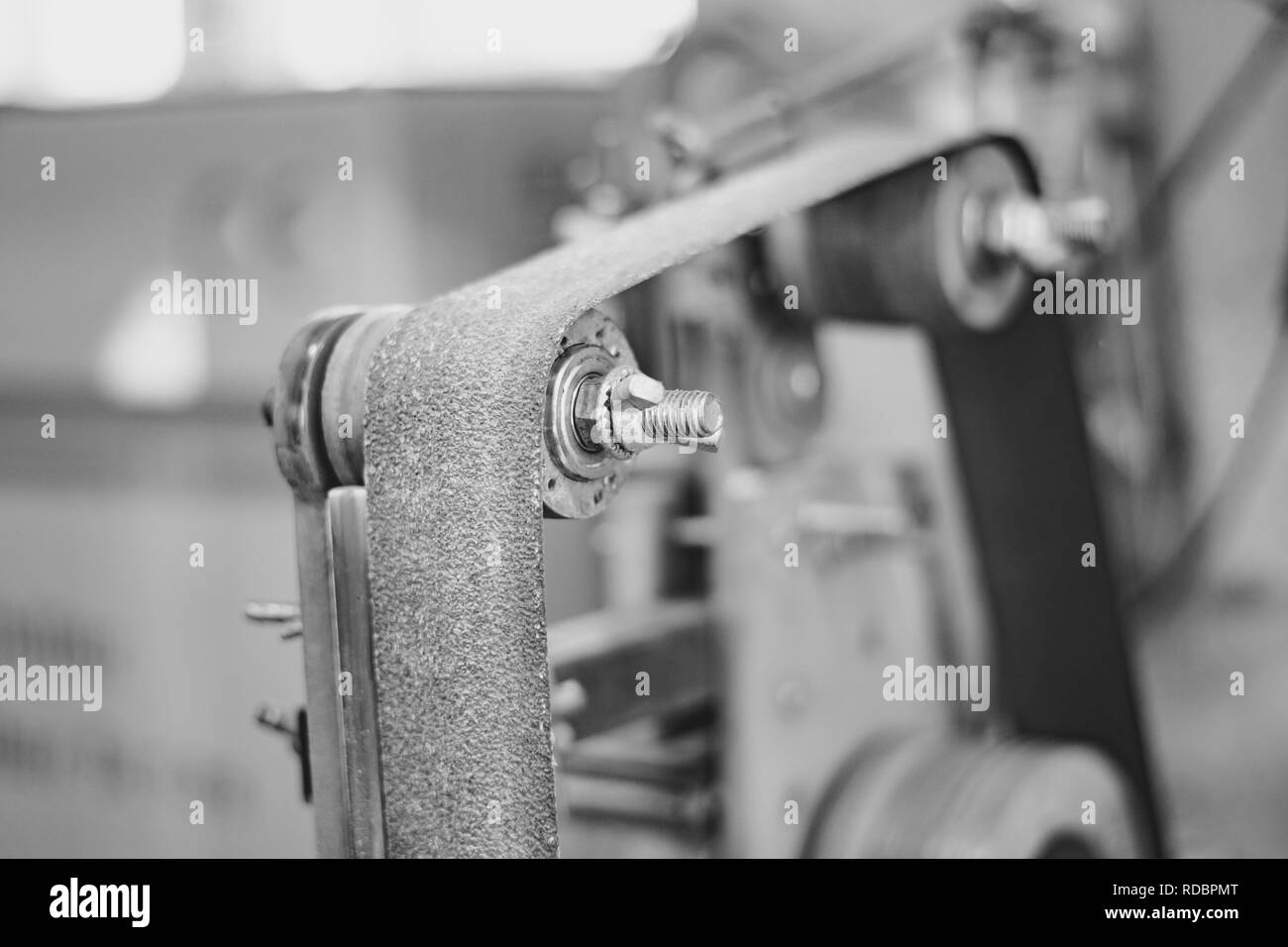 Old grinding machine and wheel in workshop or small factory blur background Stock Photo