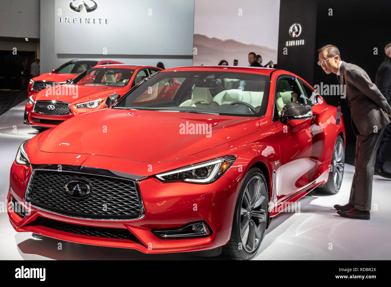 Detroit, Michigan - Three red Infiniti vehicles on display at the North American International Auto Show. From front: Q60S, Q50S, QX50. Stock Photo