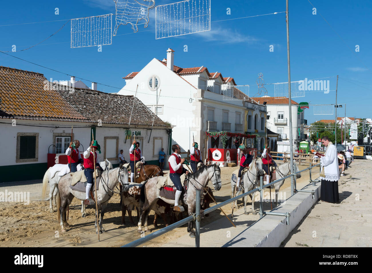 Horsemen blessing in front of the main church of the city, Festas do Barrete Verde e das Salinas, Alcochete, Setubal Province, Portugal Stock Photo