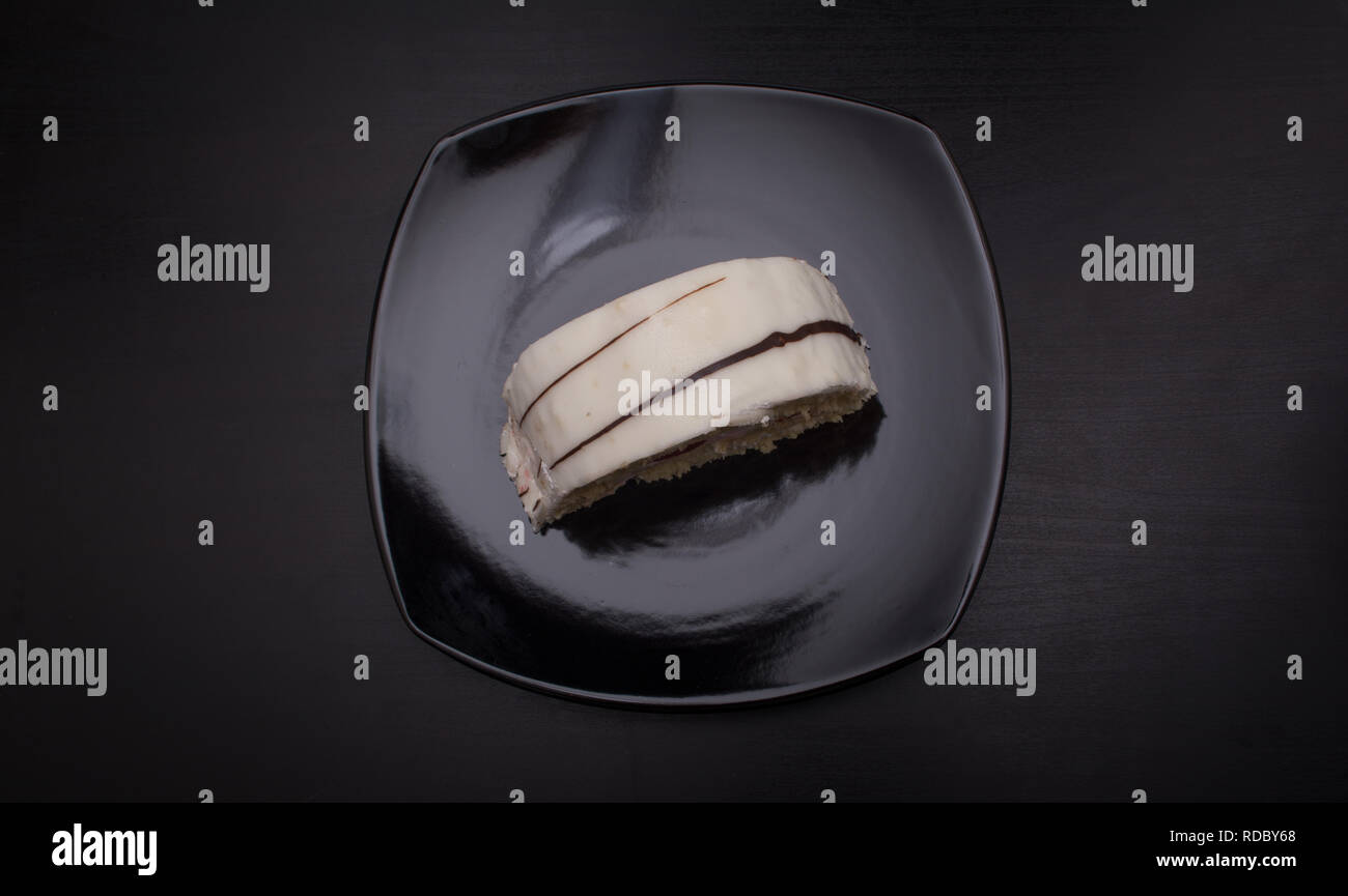 Vanilla Cake , GATEAUX , served on black dish Stock Photo