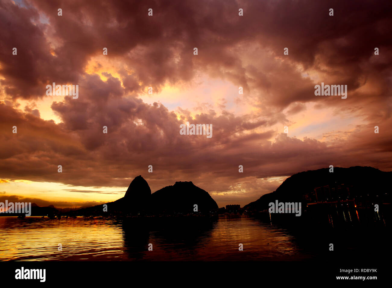 Sunrise at Baia de Guanabara with Sugarloaf in the background, Rio de Janeiro, Brazil Stock Photo