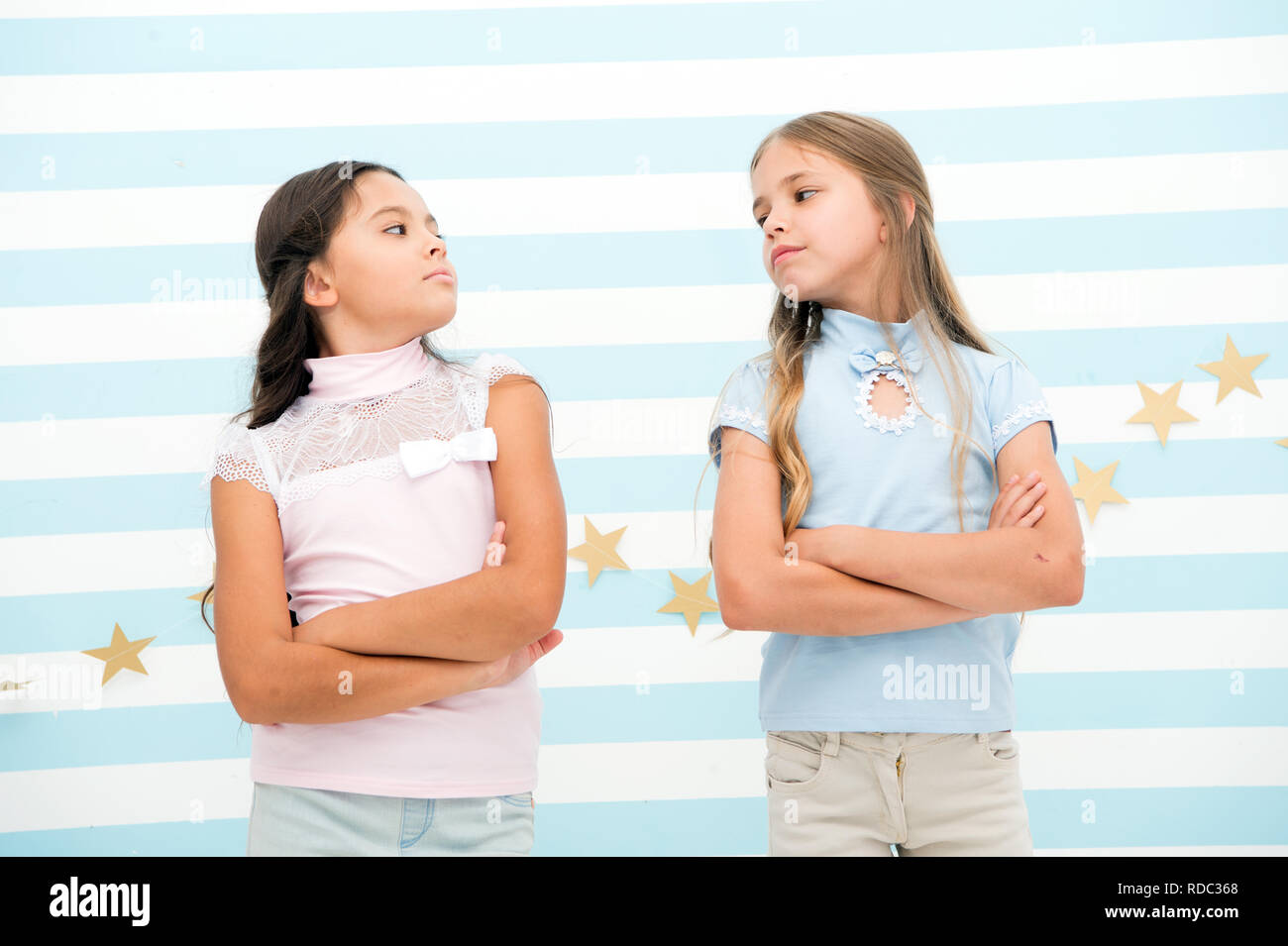 Schoolgirls haughty arrogant with folded arms chest. Best friends ...