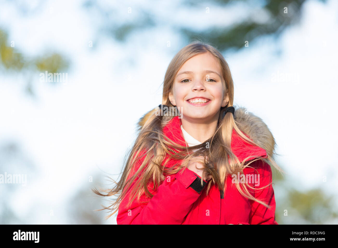 Fall fashion. Kid girl wear coat for fall season. Child cheerful