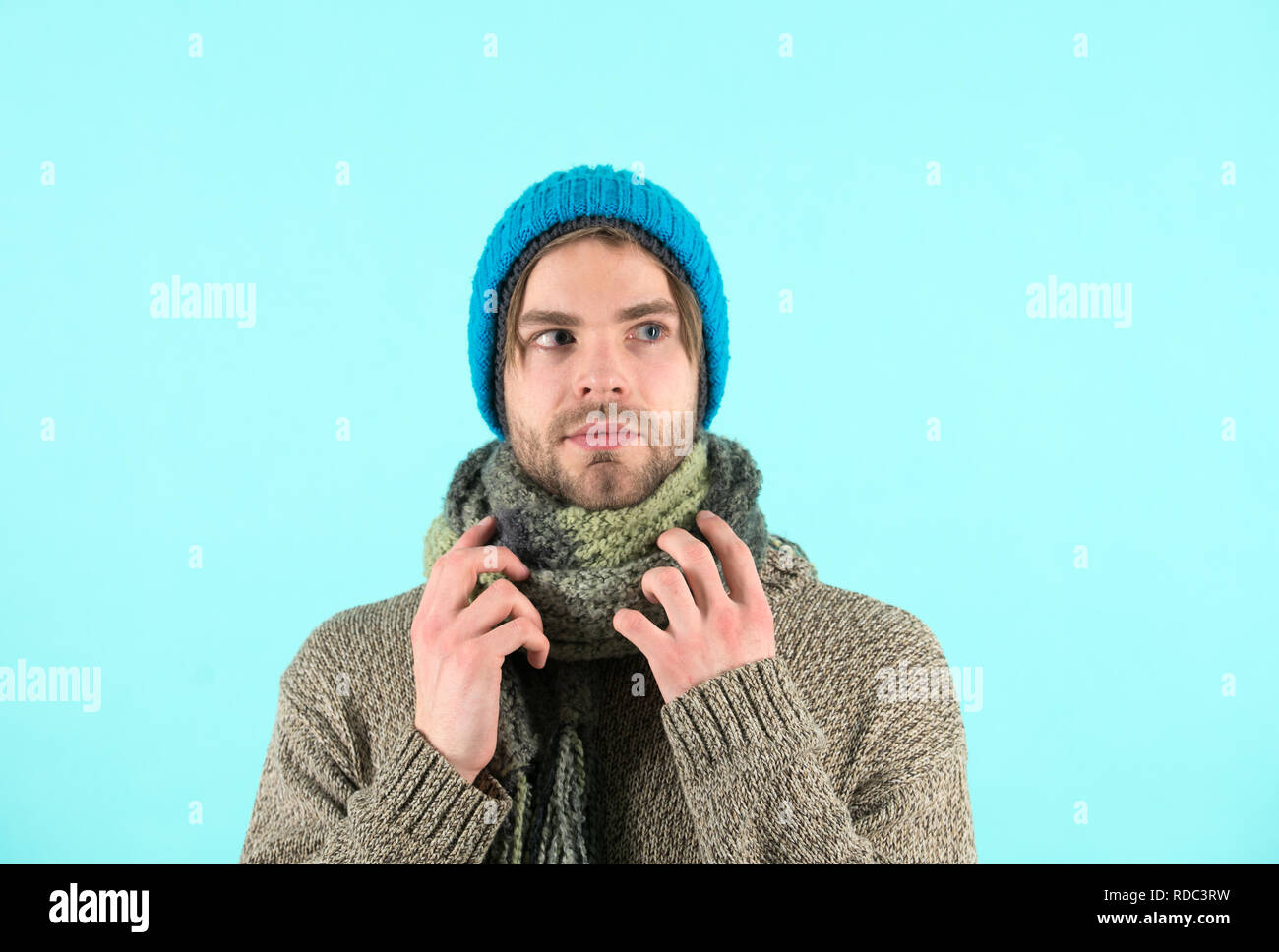 Winter is coming. Man wear winter clothes in cold weather. Bearded man got cold and flu. Cold nose, warm heart. Stock Photo