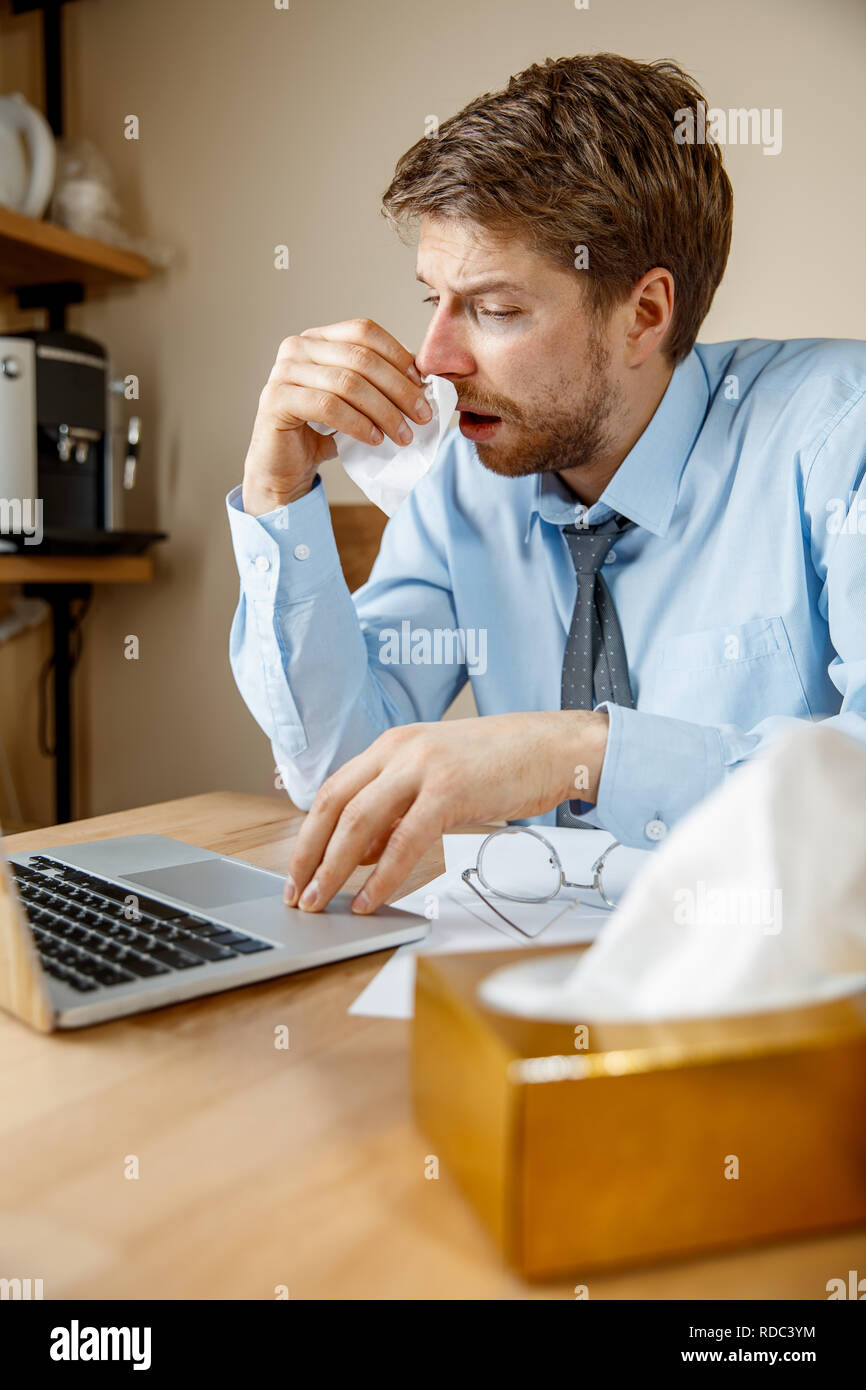 Businessman blowing his nose hires stock photography and images Alamy