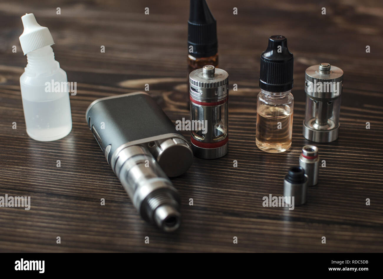 Kit for healthy smoking on wooden background, e-cigarette Stock Photo