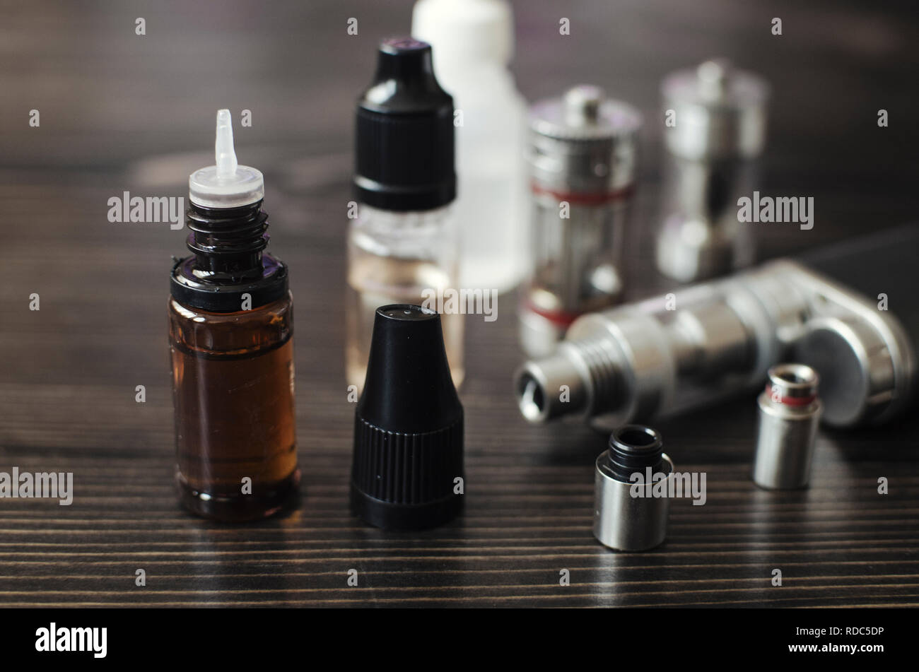 Kit for healthy smoking on wooden background, e-cigarette Stock Photo