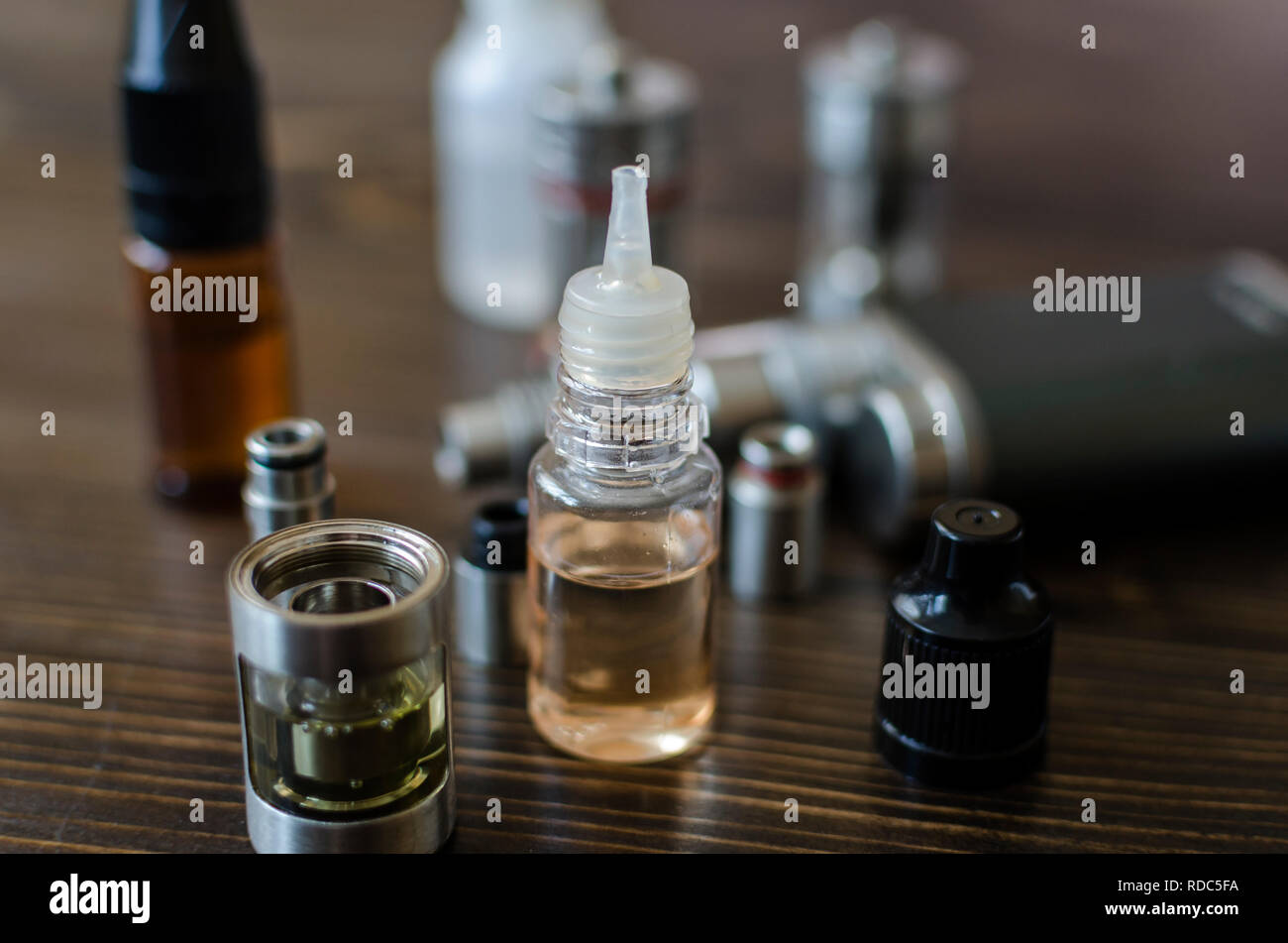 Kit for healthy smoking on wooden background, e-cigarette Stock Photo