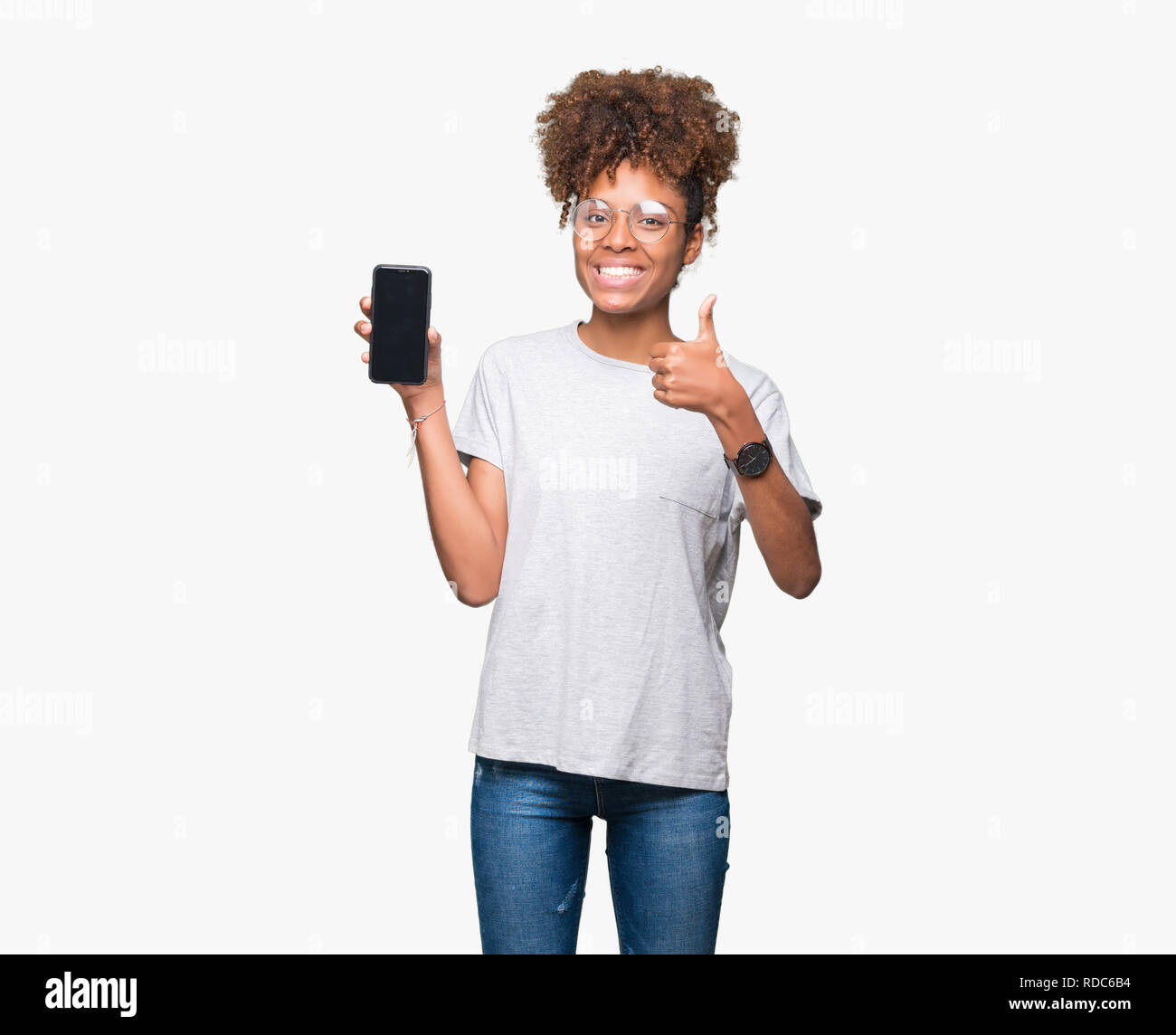 Young african american woman showing smartphone screen over isolated ...