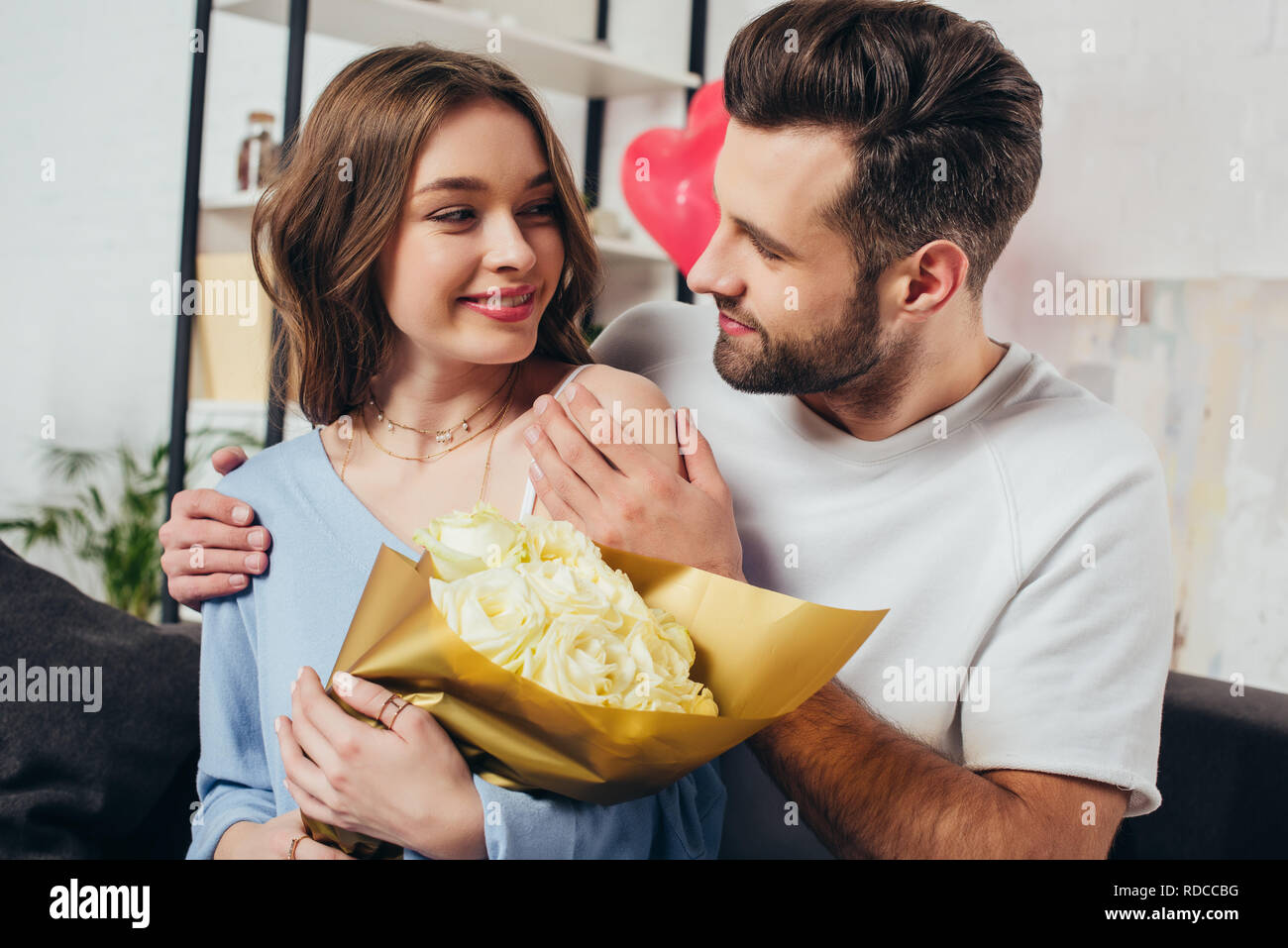 happy couple celebrating st valentine day while young man hugging ...