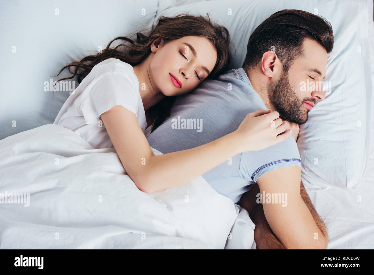 Woman embracing man hi-res stock photography and images - Alamy