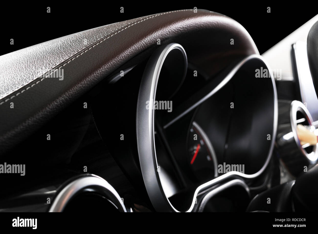 Close up shot of a dashboard in a car. Car dashboard. Brown leather