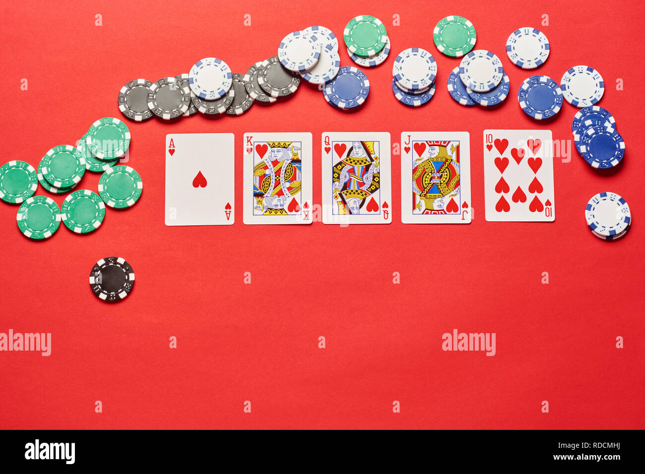 Poker Hands Flush. Five playing cards - the poker royal flush hand. Poker chips on red casino table. success in gambling. Flat background Stock Photo - Alamy