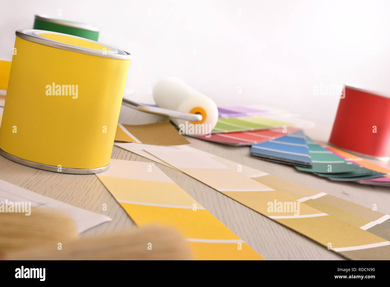 Tools and material on designer interior table with painting project. Front view. Horizontal composition Stock Photo