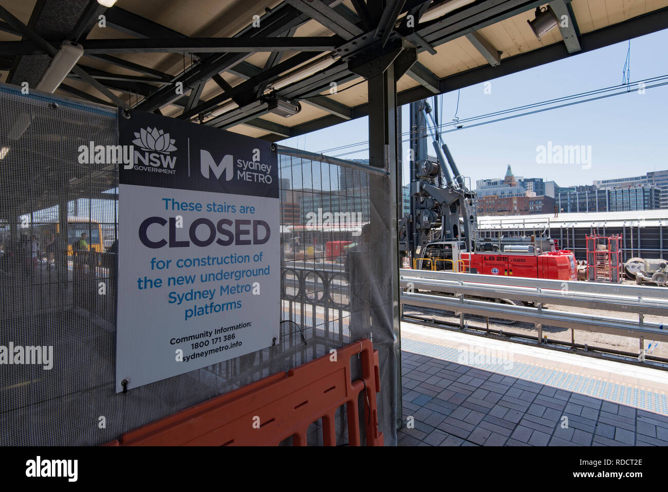 A closed sign at the top of a staircase on a Central Station platform and nearby earthworks, part of the construction of the new Sydney  Metro line Stock Photo