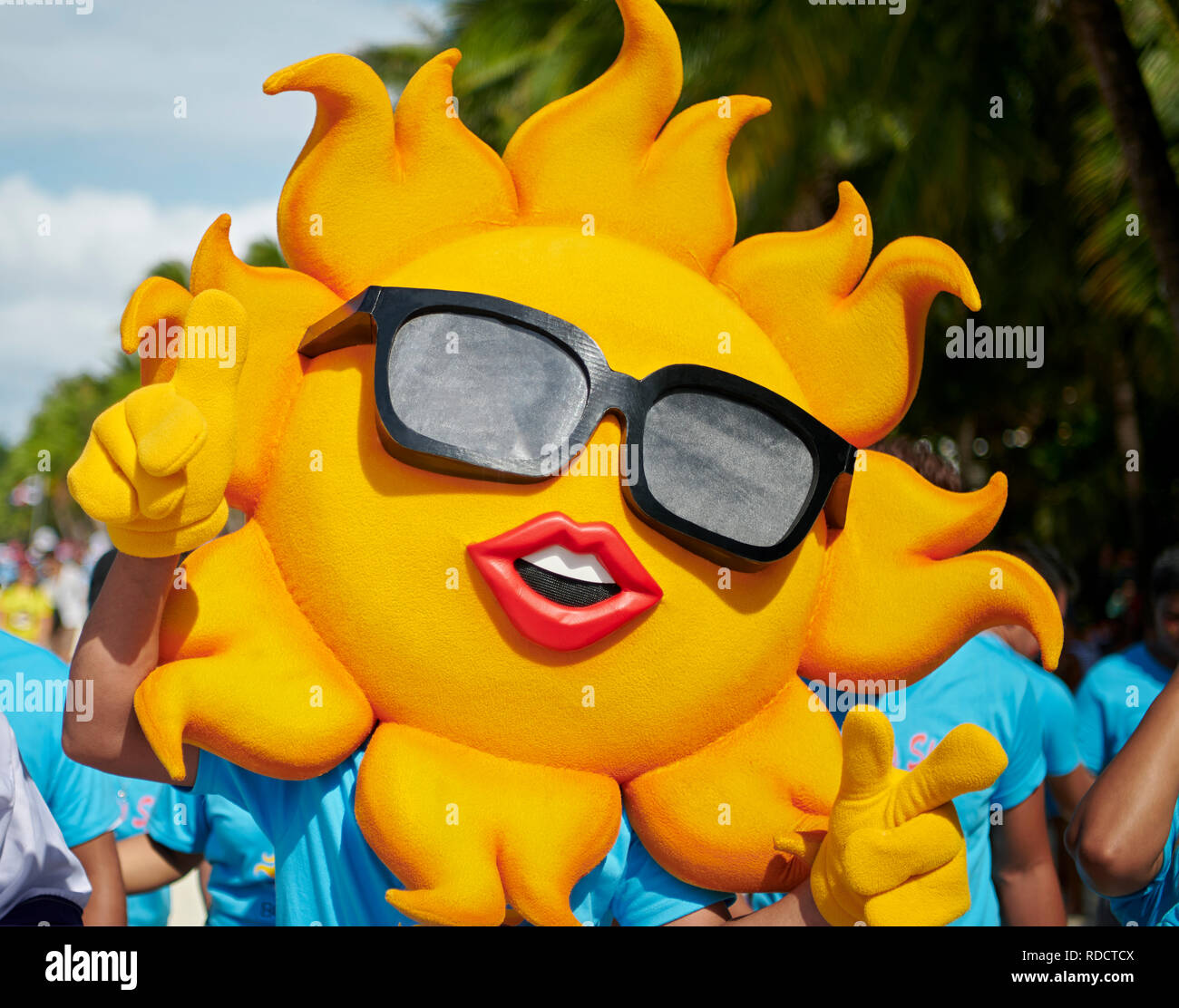 Participants wearing a sun costume at a parade at the Ati-Atihan Festival on Boracay Island, Aklan Province, Philippines Stock Photo