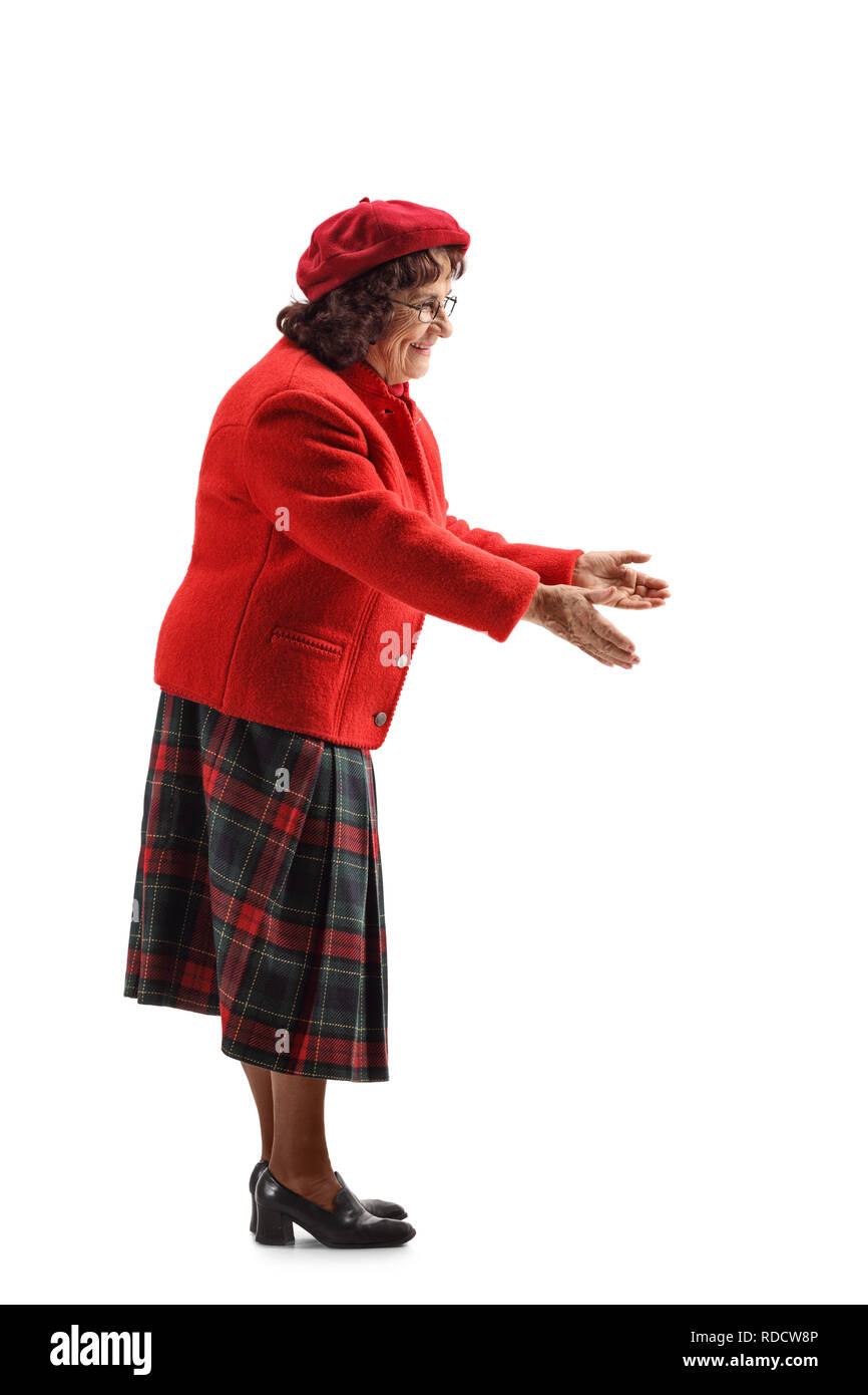 Full length profile shot of a mature woman gesturing with hands towards something isolated on white background Stock Photo