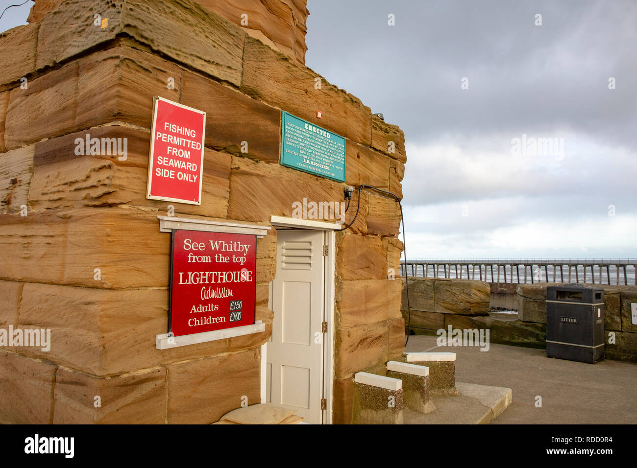 Whitby lighthouse and quayside, Whitby harbour,North Yorkshire,England Stock Photo
