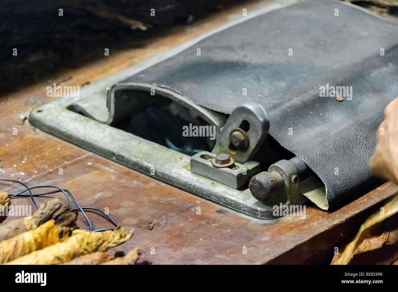 A cigar rolling machine Inside a cigar factory. Traditional manufacture