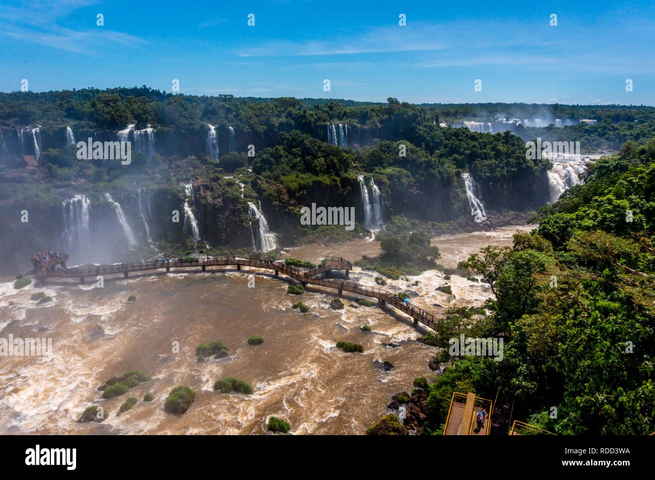 Aerial view of Iguazu Falls and footbridge above Iguazu River Stock Photo