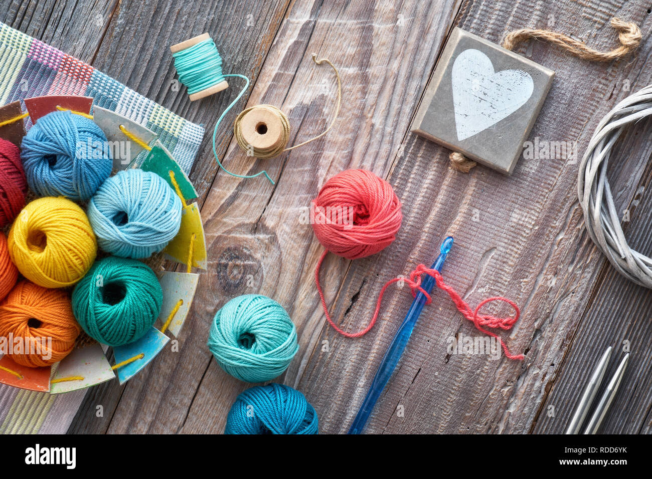 Crochet, top view on yarn balls on rustic wooden boards Stock Photo