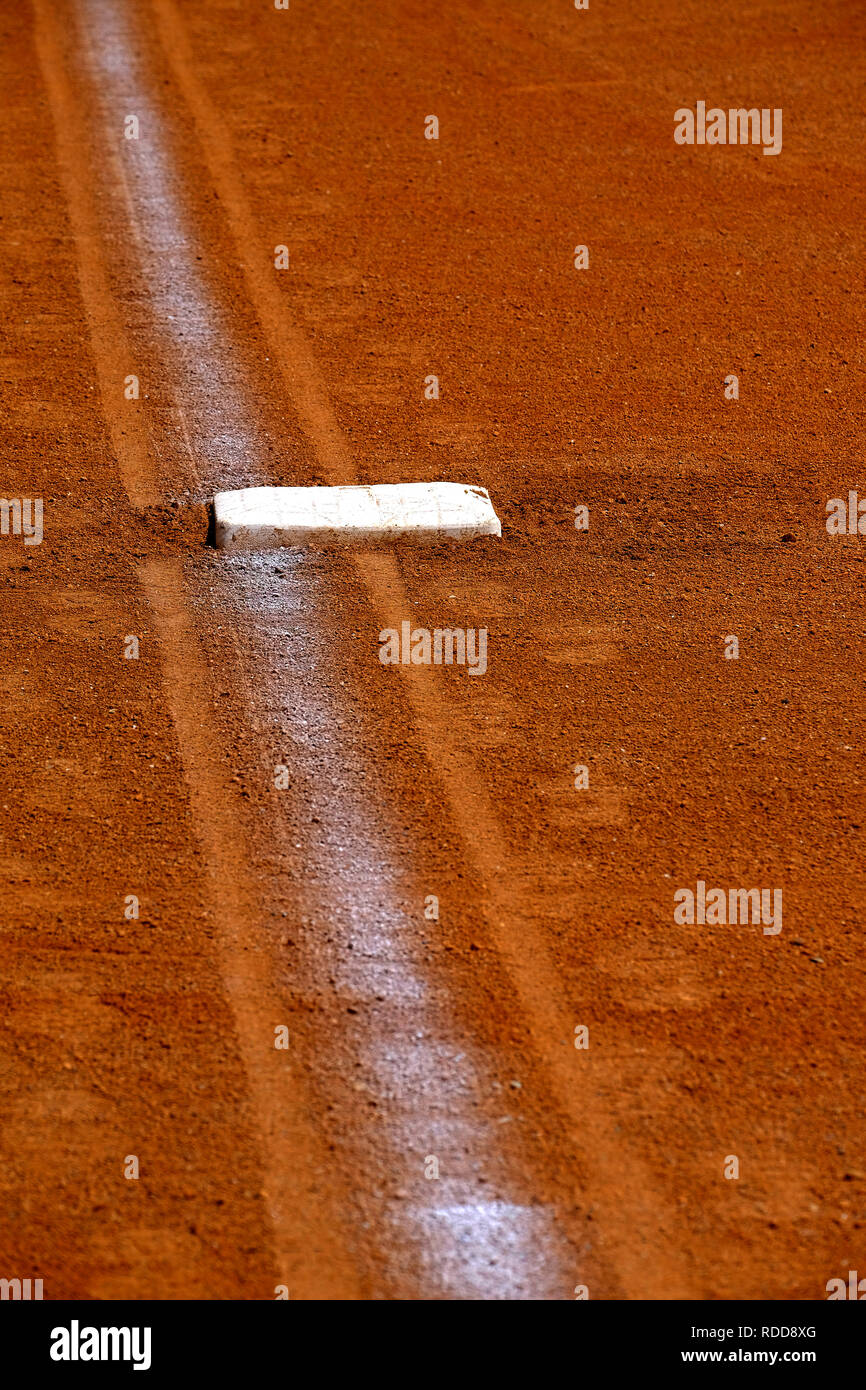 Baseball base and chalked base line in diamond Stock Photo