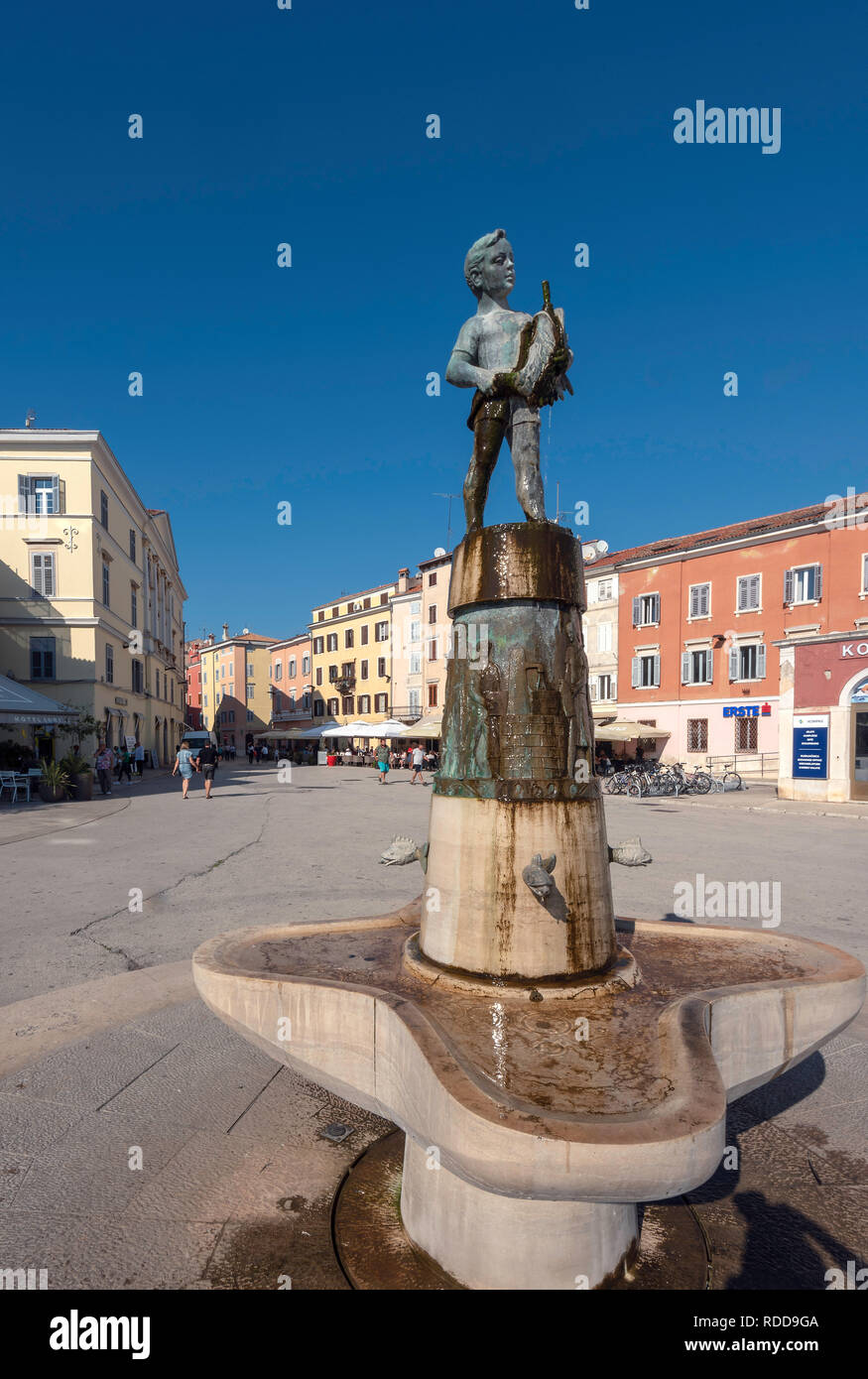 Fountain with statue of boy with fish, Rovinj, Croatia Stock Photo