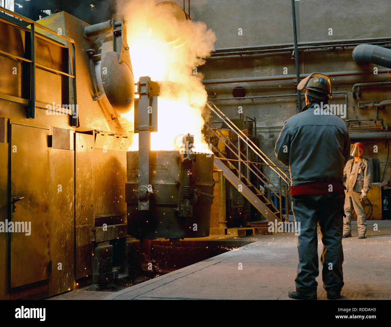 Berlin, Germany - April 18, 2013: Production of metal components in a foundry - group of workers Stock Photo
