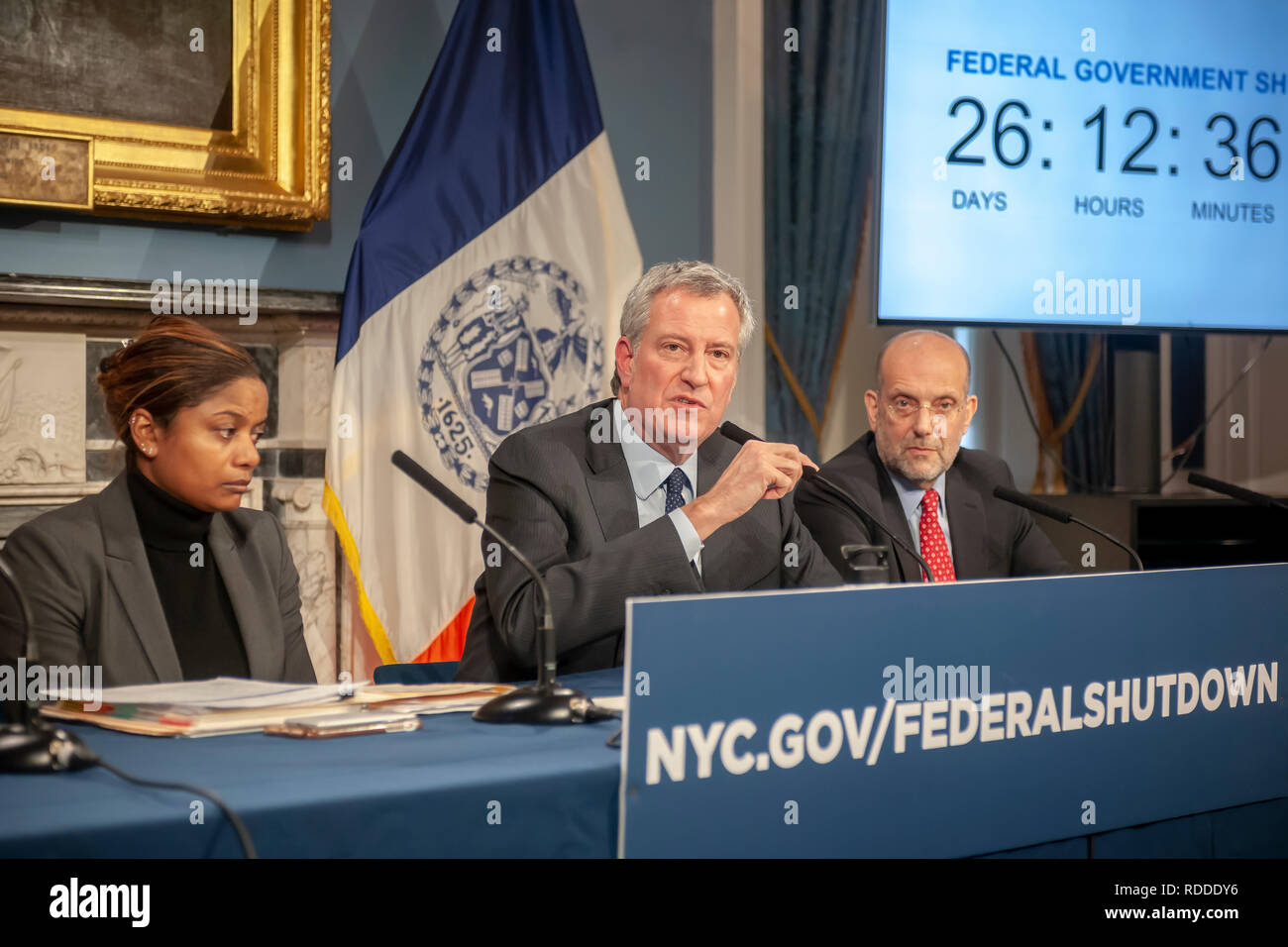 New York, USA. 17th Jan 2019. New York Mayor Bill de Blasio, center,  with Steven A. Banks, New York City Human Resources Administration/Department of Social Services, right, and Budget Director Melanie Hartzog, left, at a press conference in the Blue Room in New York City Hall on Thursday, January 17, 2019 on the effects of the government shutdown on funding of services in New York. As the shutdown progresses funding for Section 8 vouchers, SNAP benefits and an assortment of other services will cease putting New Yorkers who rely on them at risk.  Credit: Richard Levine/Alamy Live News Stock Photo
