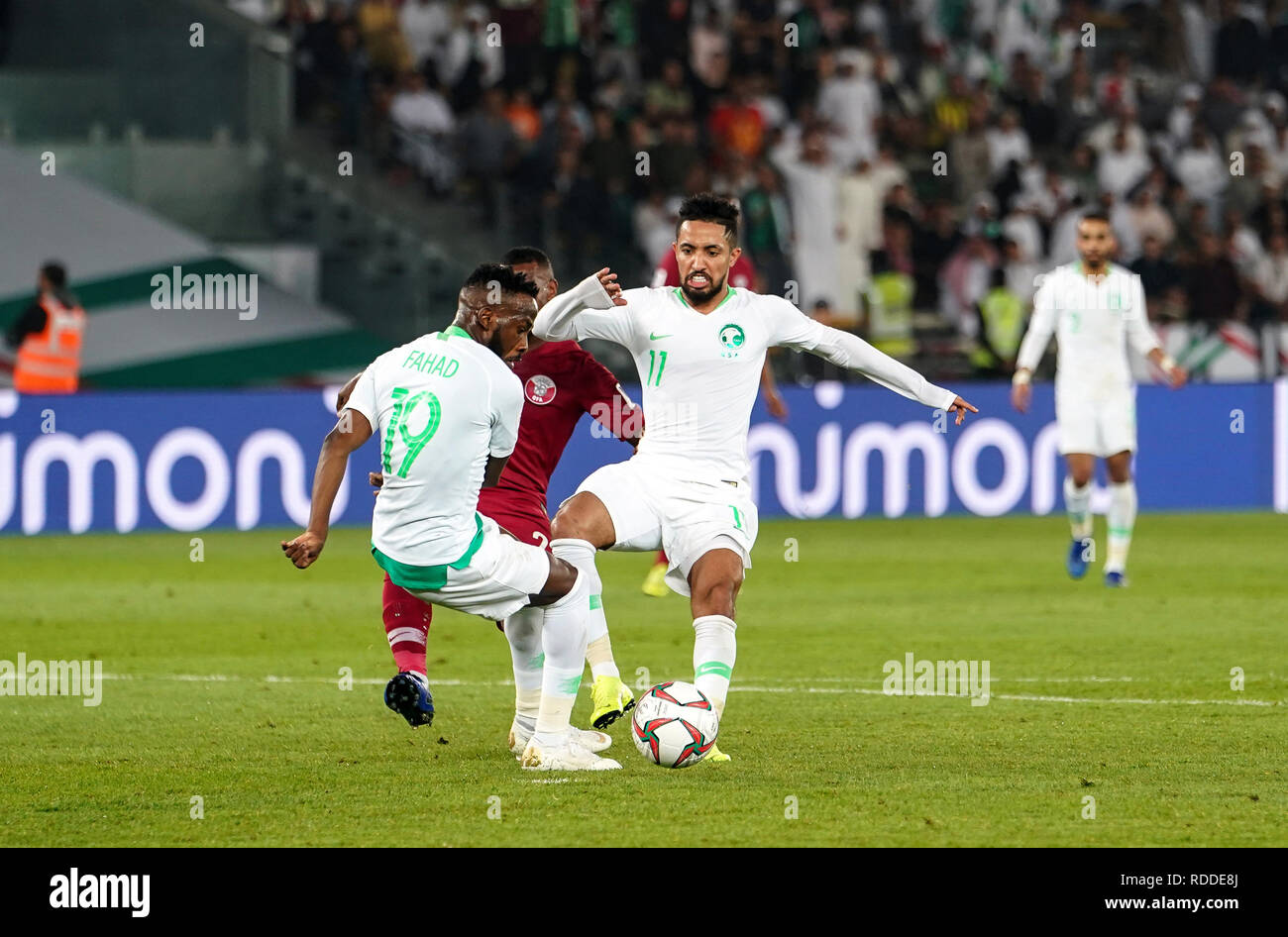 17th January 2019, Zayed Sports City Stadium, Abu Dhabi, United Arab Emirates; AFC Asian Cup football, Saudi Arabia versus Qatar; Hattan Bahebri of Saudi Arabia and Fahad Al-Muwallad of Saudi Arabia trying to get to the ball Stock Photo