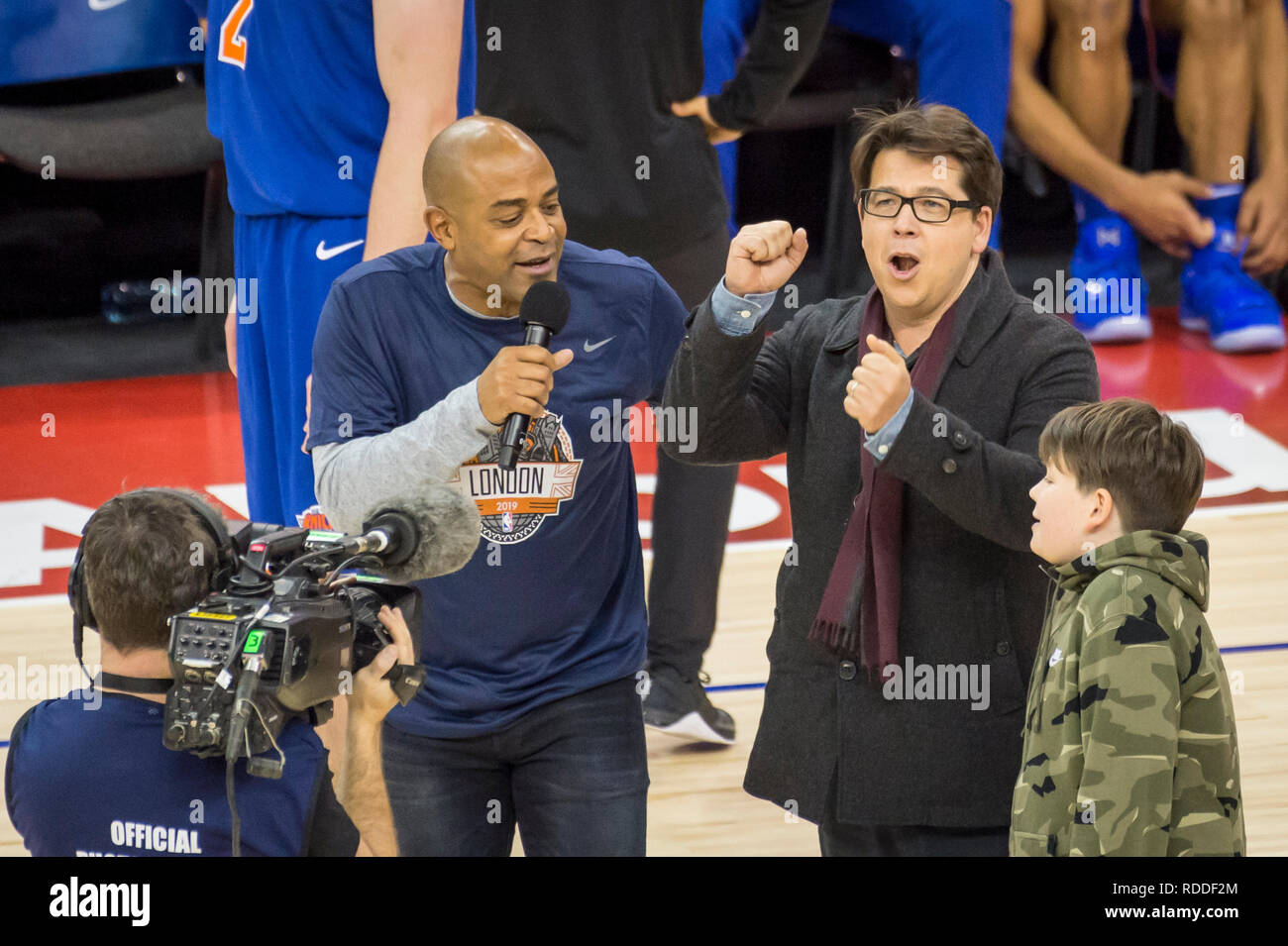 Londo , UK.  17 January 2019. Michael McIntyre (2R) and his son Ossie are interviewed during an NBA basketball game, NBA London 2019, between Washington Wizards and New York Knicks at the O2 Arena.  Final score: Wizards 101 Knicks 100.  Credit: Stephen Chung / Alamy Live News Stock Photo