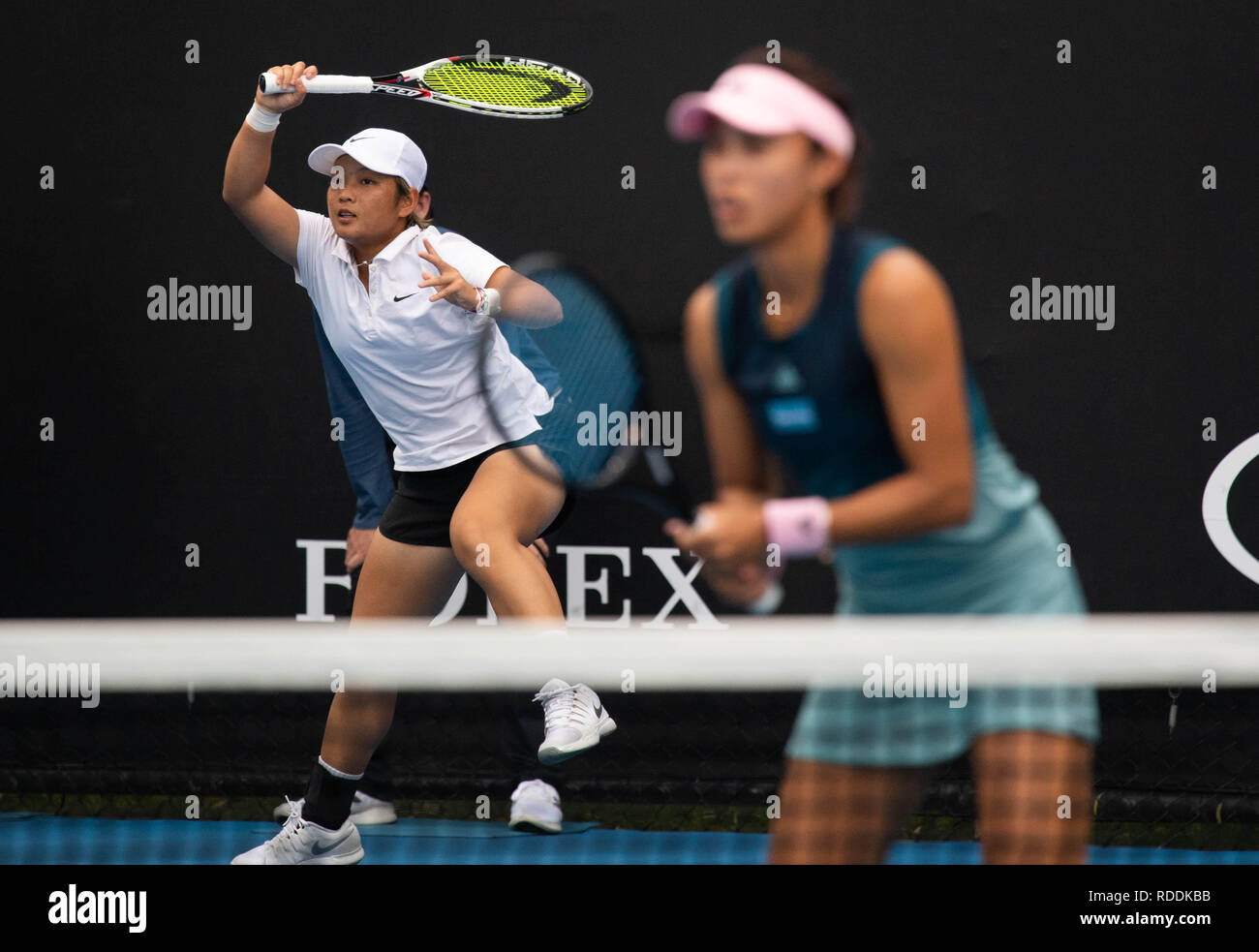 Melbouren, Australia. 18th Jan, 2019. Wang Qiang/Jiang Xinyu (L) of China compete during their women's doubles second round match against Chan Latisha/ Chan Hao-Ching of Chinese Taipei at the Australian Open in Melbourne, Australia, Jan. 18, 2019. Credit: Bai Xue/Xinhua/Alamy Live News Stock Photo