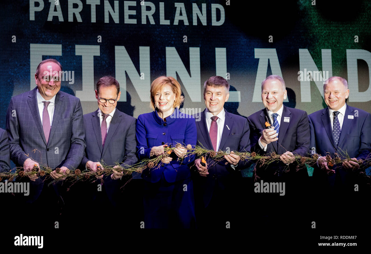 18 January 2019, Berlin: Joachim Rukwied (l-r), President of the German Farmers' Union, Michael Müller (SPD), Governing Mayor of Berlin, Julia Klöckner (CDU), Federal Minister of Agriculture, Juha Marttila, President of the Central Association of Agricultural Producers and Forest Owners (MTK), Jari Leppä, Minister of Agriculture of Finland, and Vytenis Andriukaitis, EU Commissioner for Health and Food Safety, are separating a plant ribbon before the opening tour of the International Green Week 2019. The fair for food, agriculture and horticulture took place for the first time in Berlin in 1926 Stock Photo