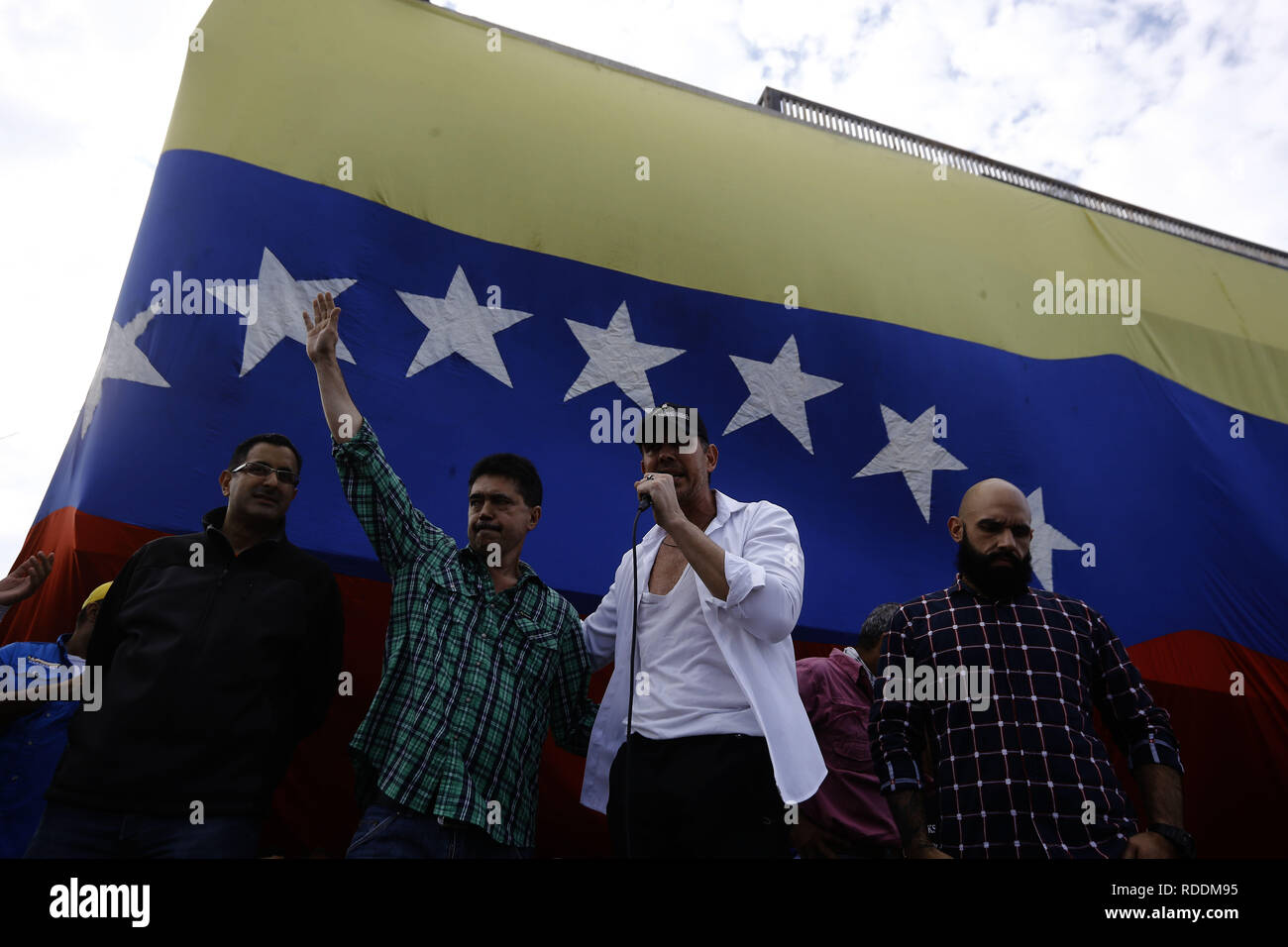 San Diego, Carabobo, Venezuela. 17th Jan, 2019. January 17, 2019. Carlos Lozano (center) Ilidio Abreu (2nd left, Angel Alvarez (left) Marcos Bozo (rigth) Deputies to the National Assembly for the state Carabobo speak in the ralization of open councils as a legal mechanism for popular consultation and obtain the support of the population for the departure of Nicolas Maduro, who is unknown as more than 60 countries as president of Venezuela. The photos correspond to the Don Julio Centeno aveneu, in the municipality San Diego, Carabobo state. Photo: Juan Carlos Hernandez (Credit Image: © Ju Stock Photo