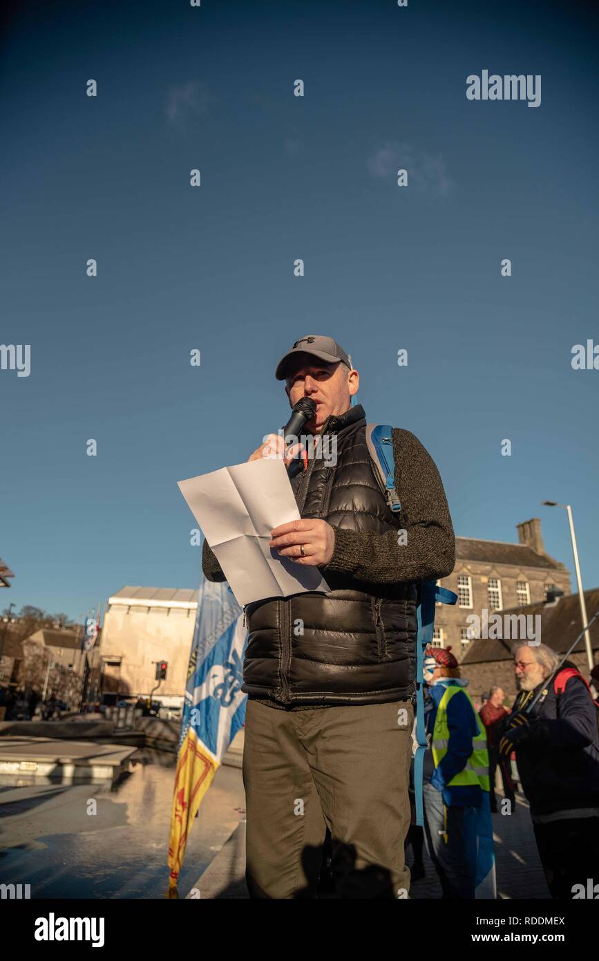 A man is seen giving a speech outside the Scottish Parliament during the protest. Protesters gathered outside Scottish Parliament building in Edinburgh to protest Brexit and to push for a second independence referendum. Stock Photo