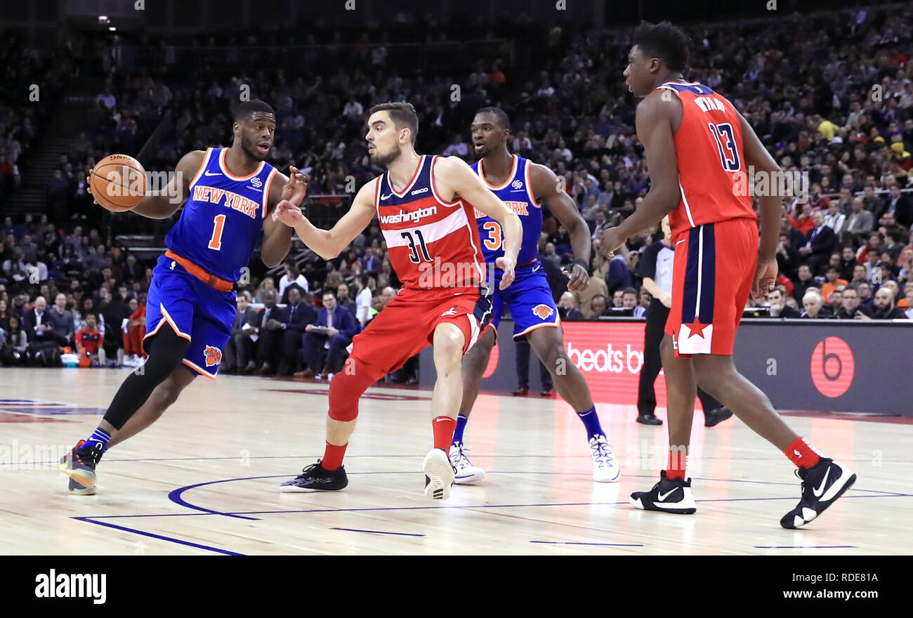 New York Knicks' Emmanuel Mudiay (left) and Washington Wizards' Tomas Satoransky (second left) battle for the ball during the NBA London Game 2019 at the O2 Arena, London. Stock Photo