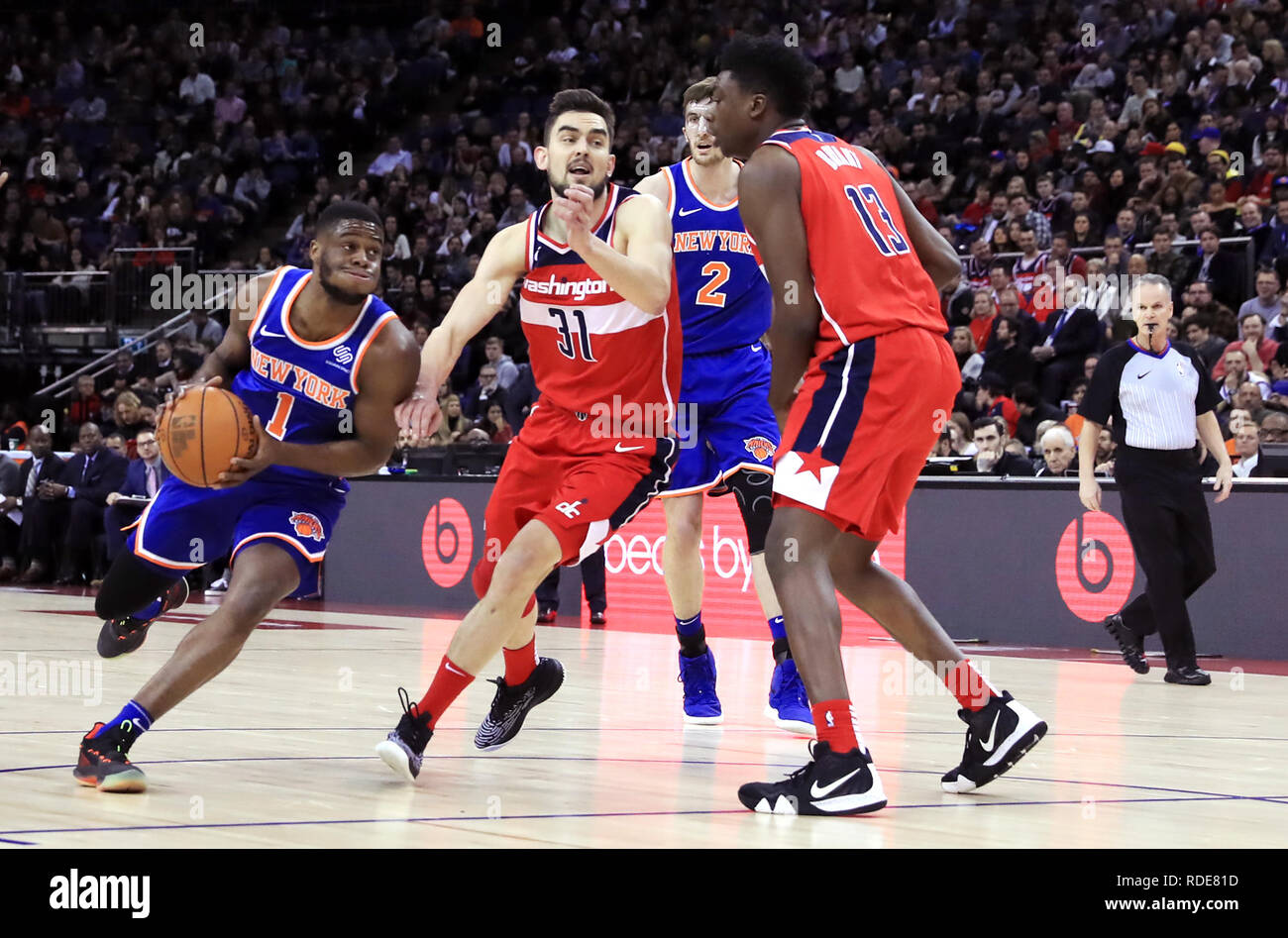 New York Knicks' Emmanuel Mudiay (left) and Washington Wizards' Tomas Satoransky (second left) battle for the ball during the NBA London Game 2019 at the O2 Arena, London. Stock Photo