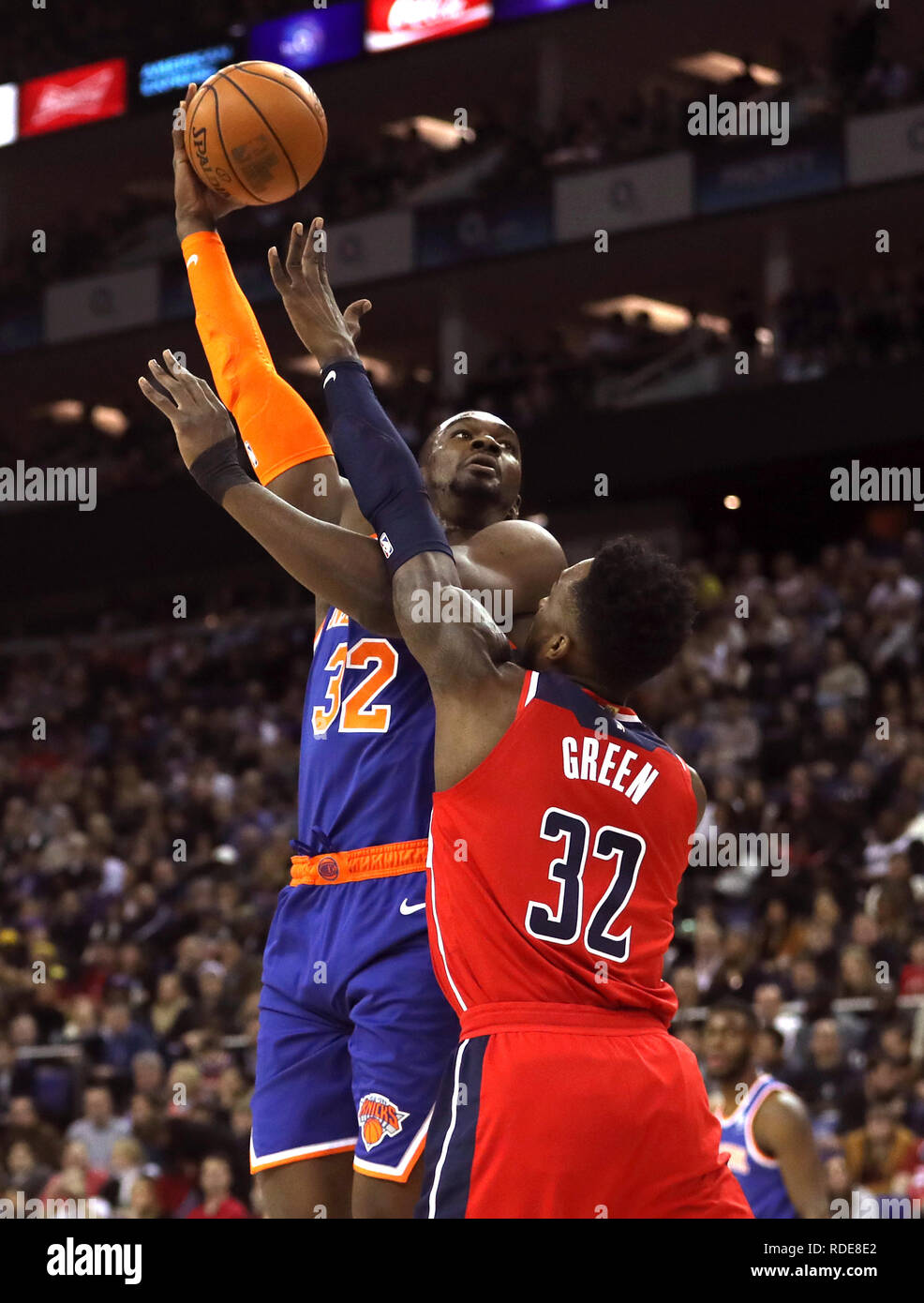 New York Knicks' Noah Vonleh (left) and Washington Wizards' Jeff Green battle for the ball during the NBA London Game 2019 at the O2 Arena, London. Stock Photo