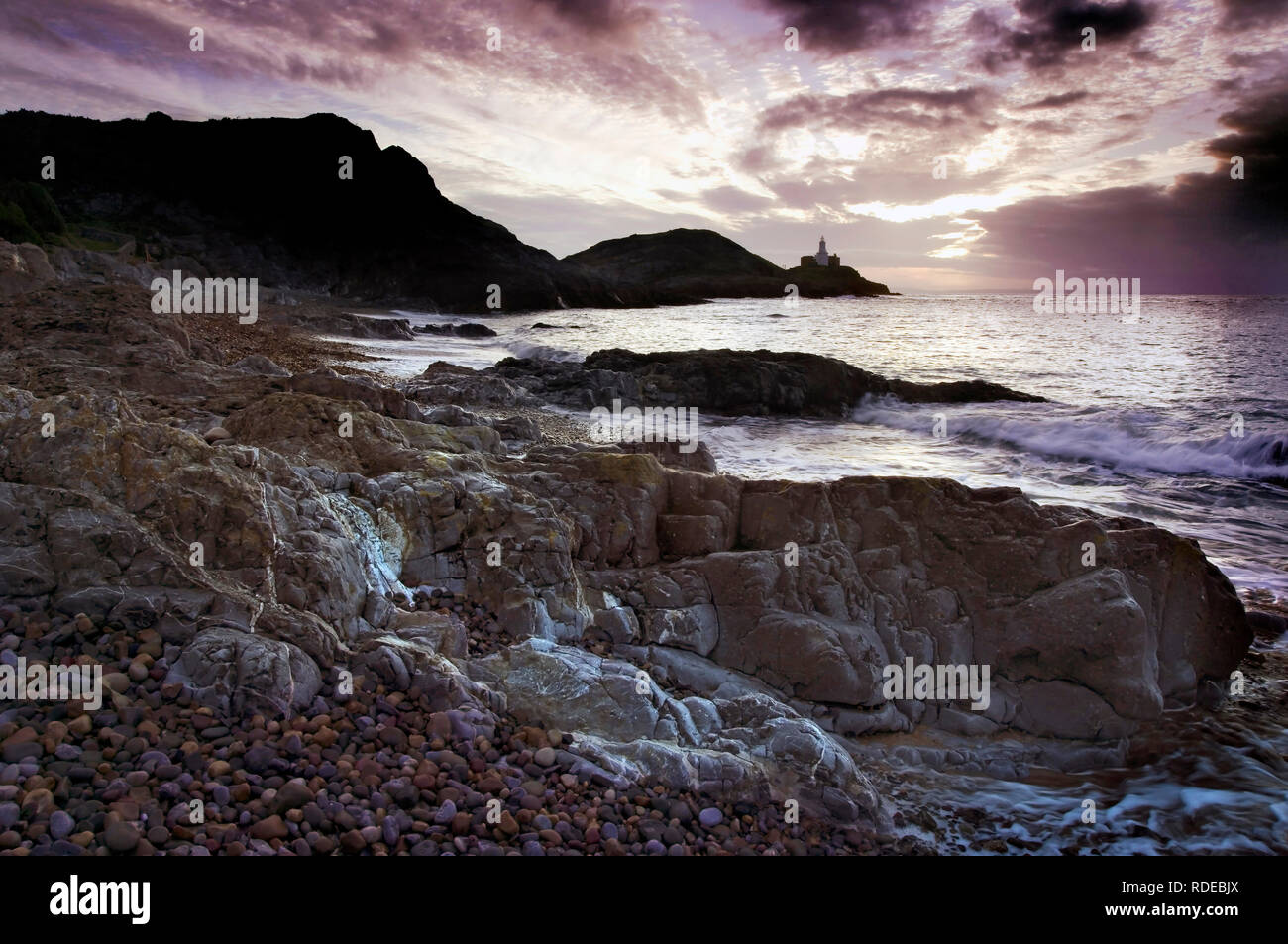 A dawn view of Mumbles Head in Swansea Bay, Wales. Stock Photo