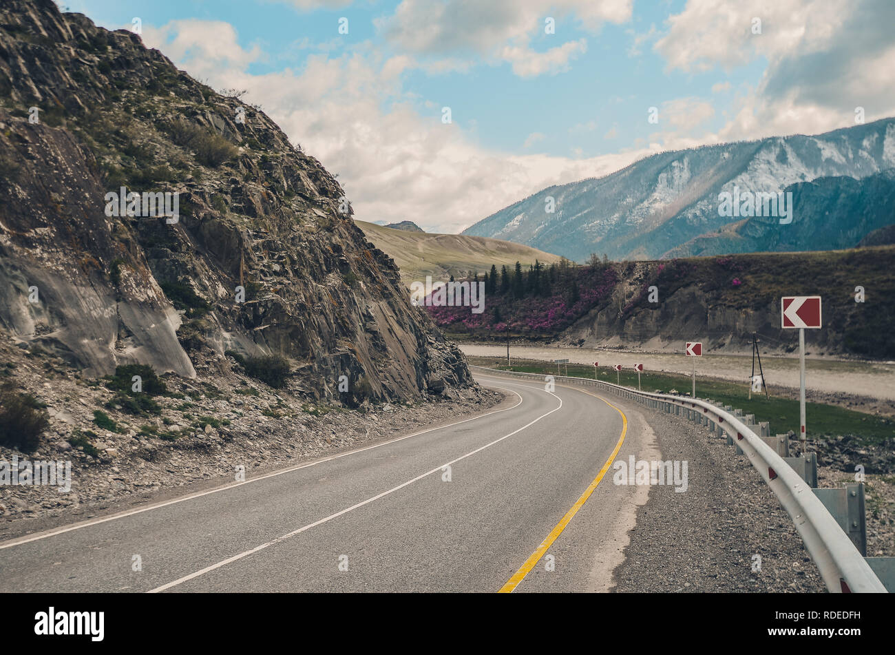 Steep turn of the road on the mountain serpentine. Mountain landscapes of the Chui tract, Altai. Valley Chuya. Stock Photo