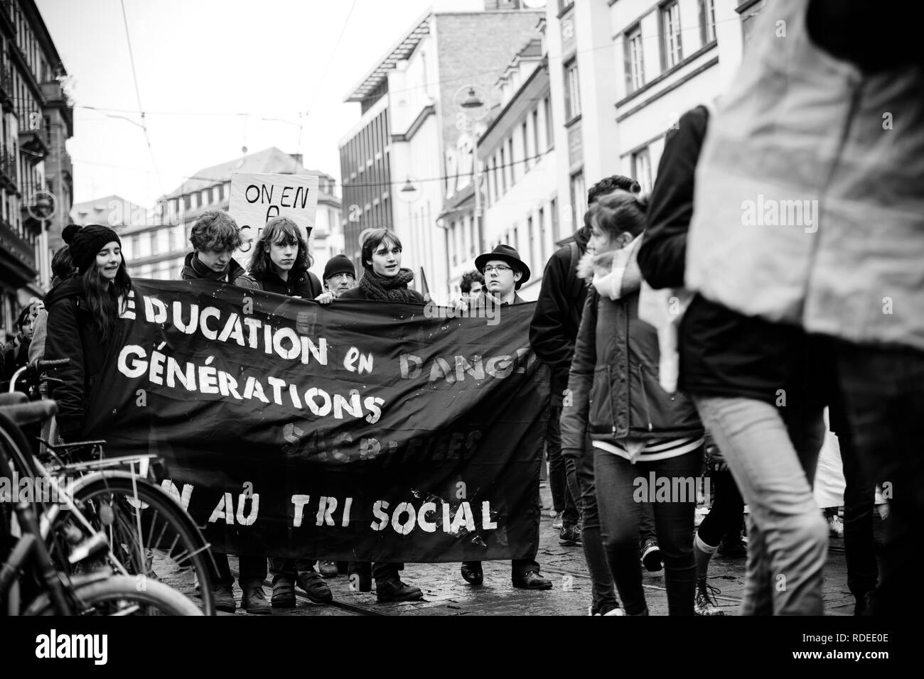 STRASBOURG, FRANCE  - MAR 22, 2018: Education generation by students with demonstration protest against Macron French government string of reforms, mutiple trade unions called public workers to strike - black and white  Stock Photo