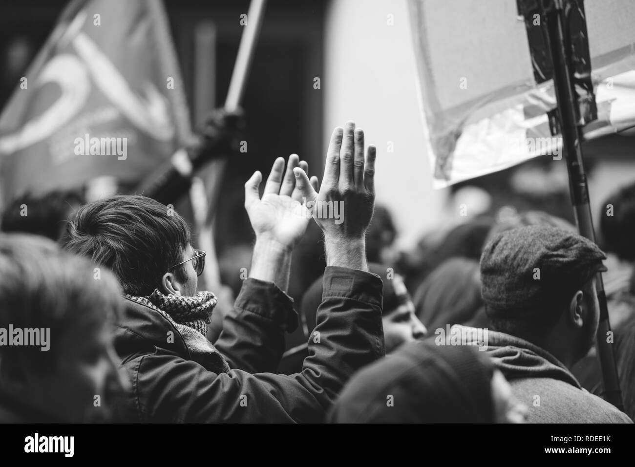 STRASBOURG, FRANCE  - MAR 22, 2018: Making noise hands demonstration protest against Macron French government string of reforms, mutiple trade unions called public workers to strike - black and white   Stock Photo