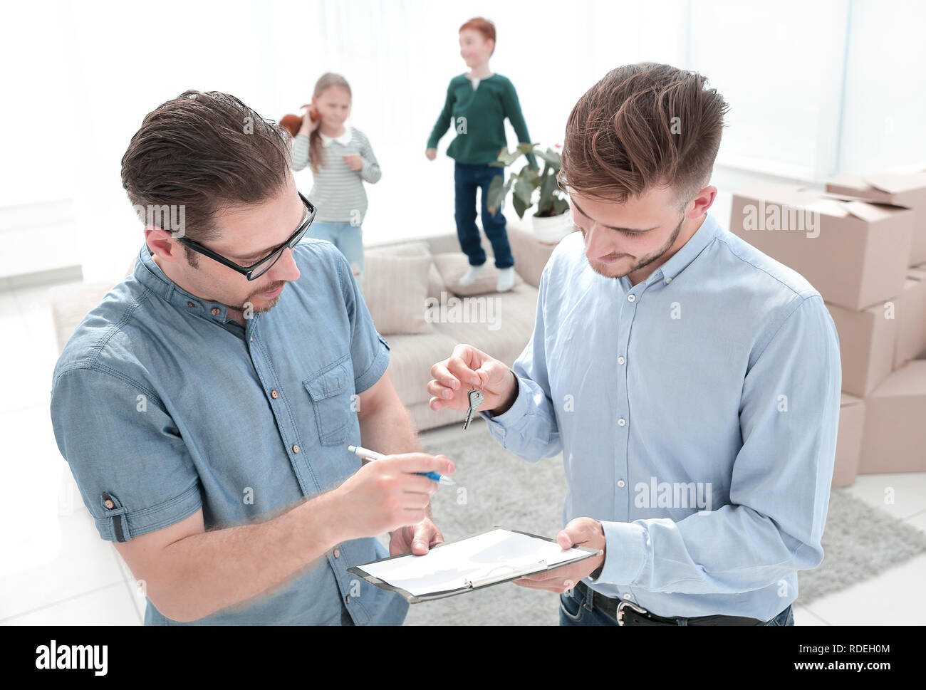 client signs the lease agreement in the new apartment Stock Photo - Alamy