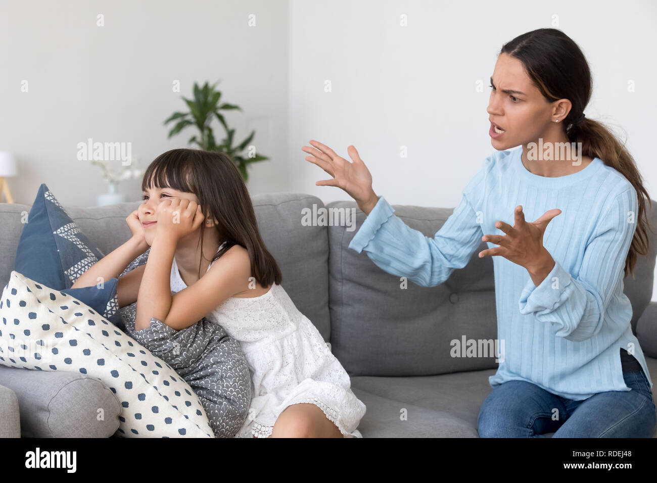 Angry annoyed mom shouting scolding for discipline lecturing stu Stock Photo